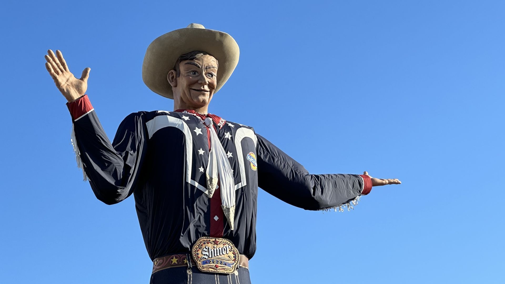 A big cowboy hovering in the sky
