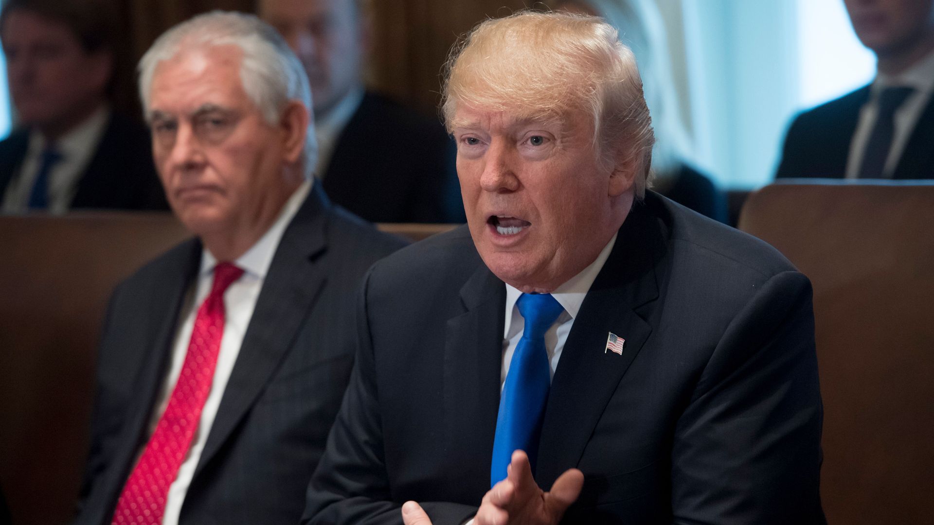 Trump talks and Tillerson is in the background looking sad.