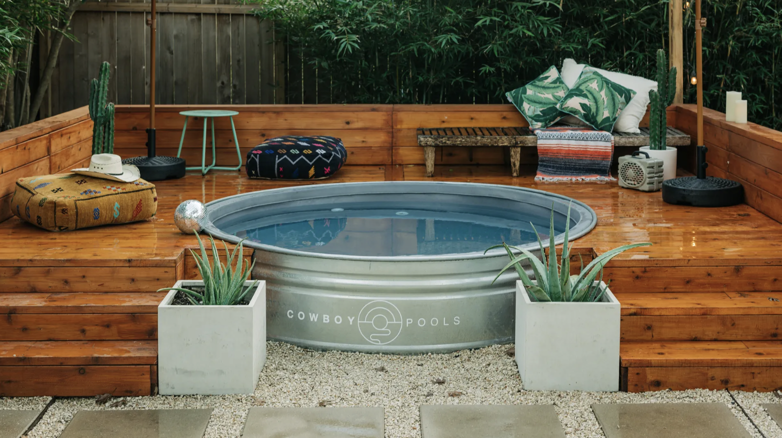 A metal trough filled with water in a patio