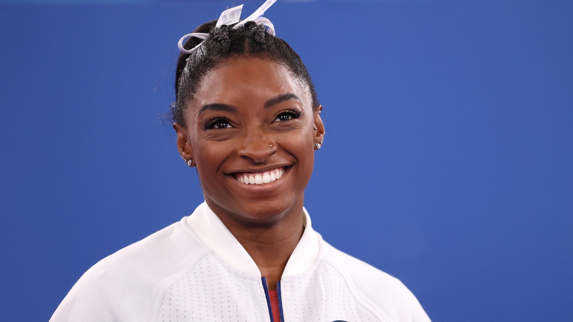 Simone Biles of Team United States smiles during the Women's Team Final on day four of the Tokyo 2020 Olympic Games at Ariake Gymnastics Centre on July 27, 2021 in Tokyo, Japan.