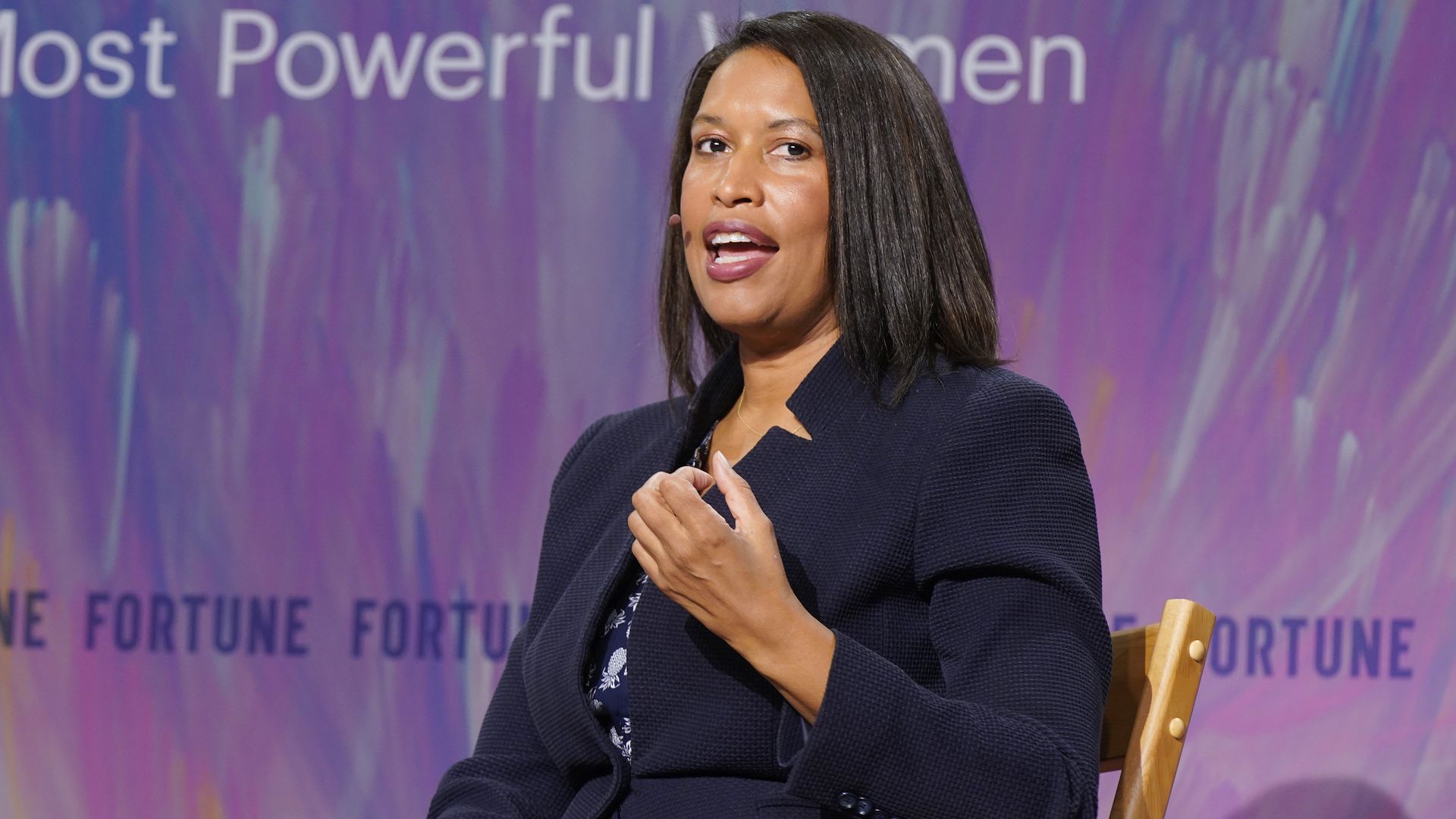 Muriel Bowser sitting on stage