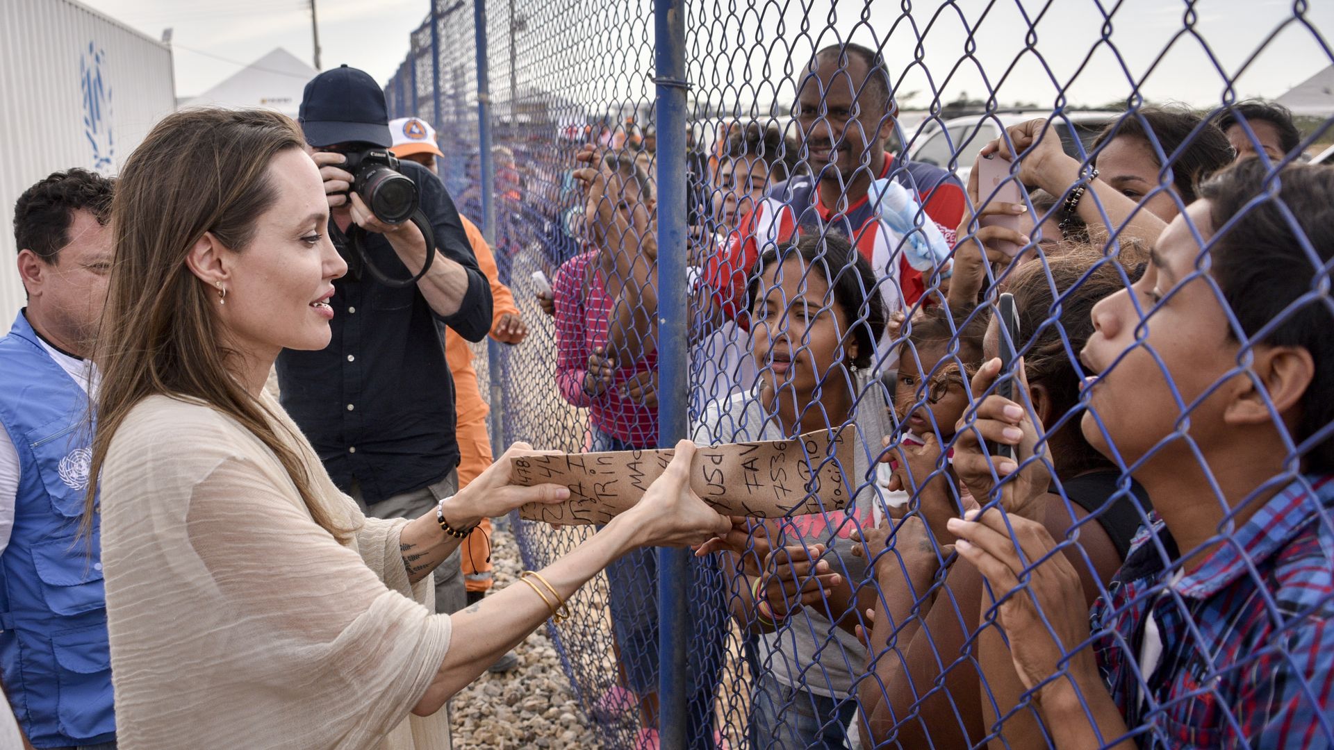 Angelina Jolie with migrants