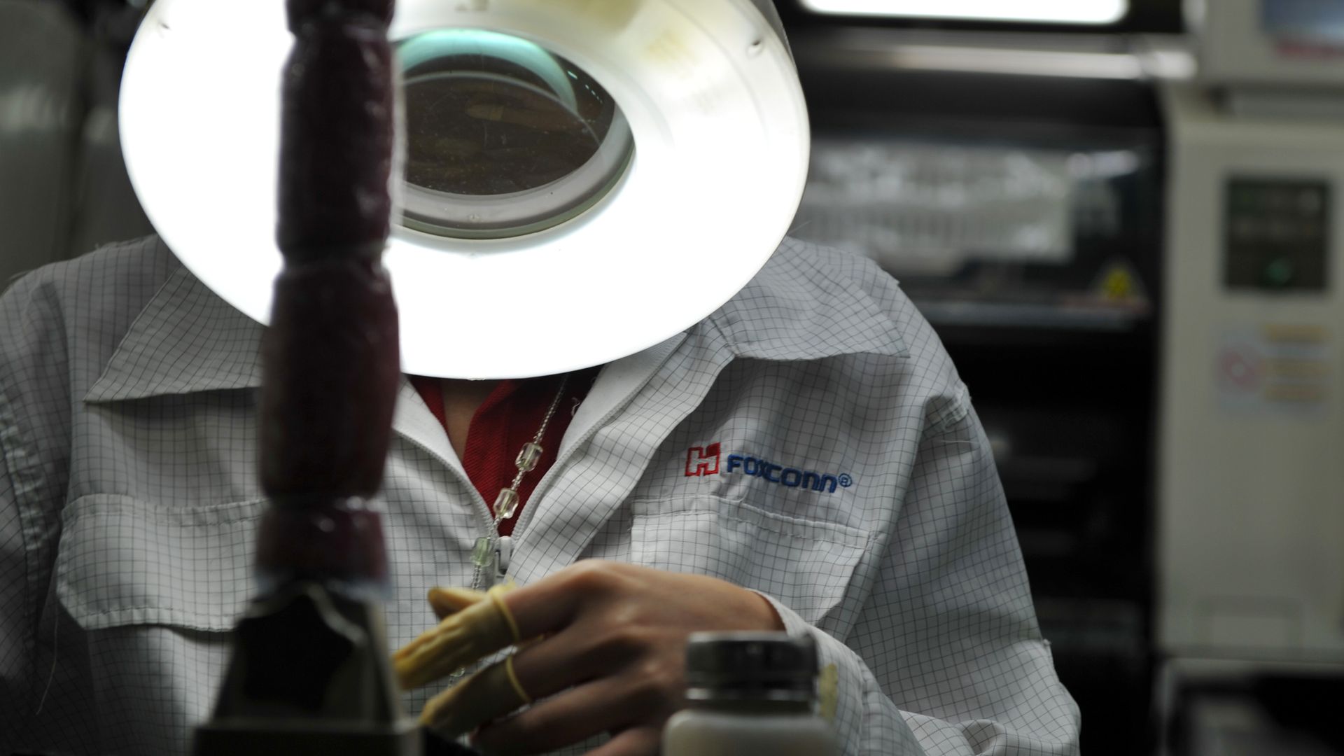 A worker on a factory line at the Foxconn plant in Shenzen