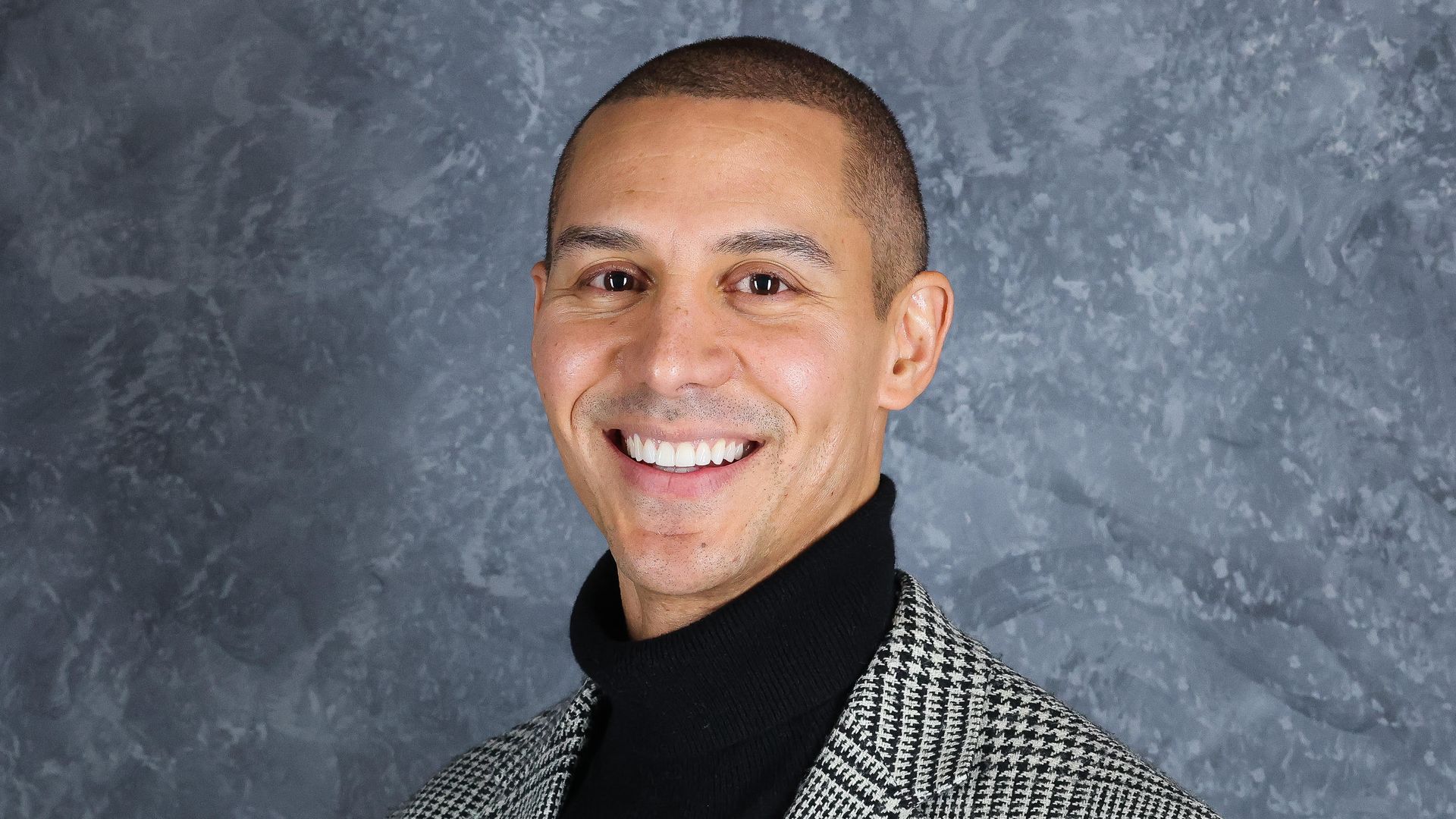 Photo of a man in a turtleneck