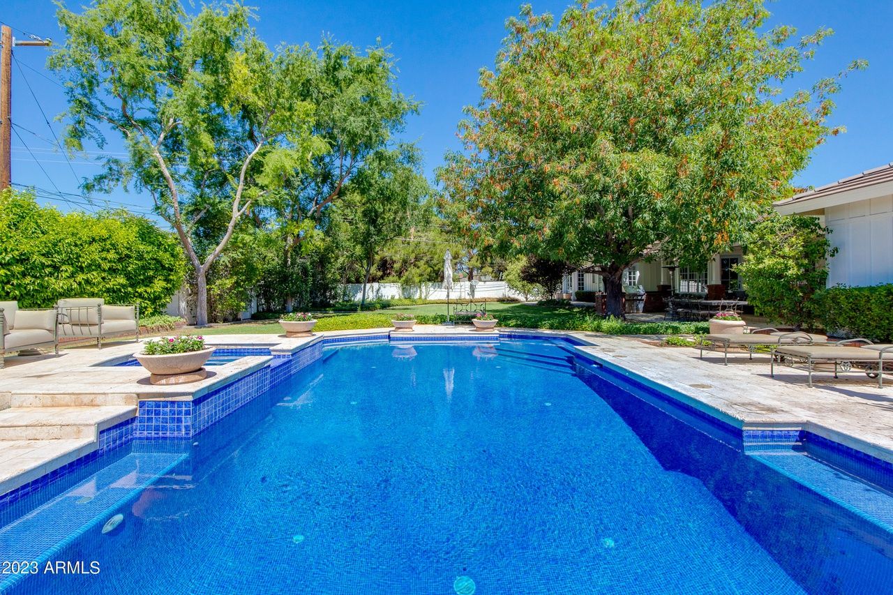 A backyard with a pool. 