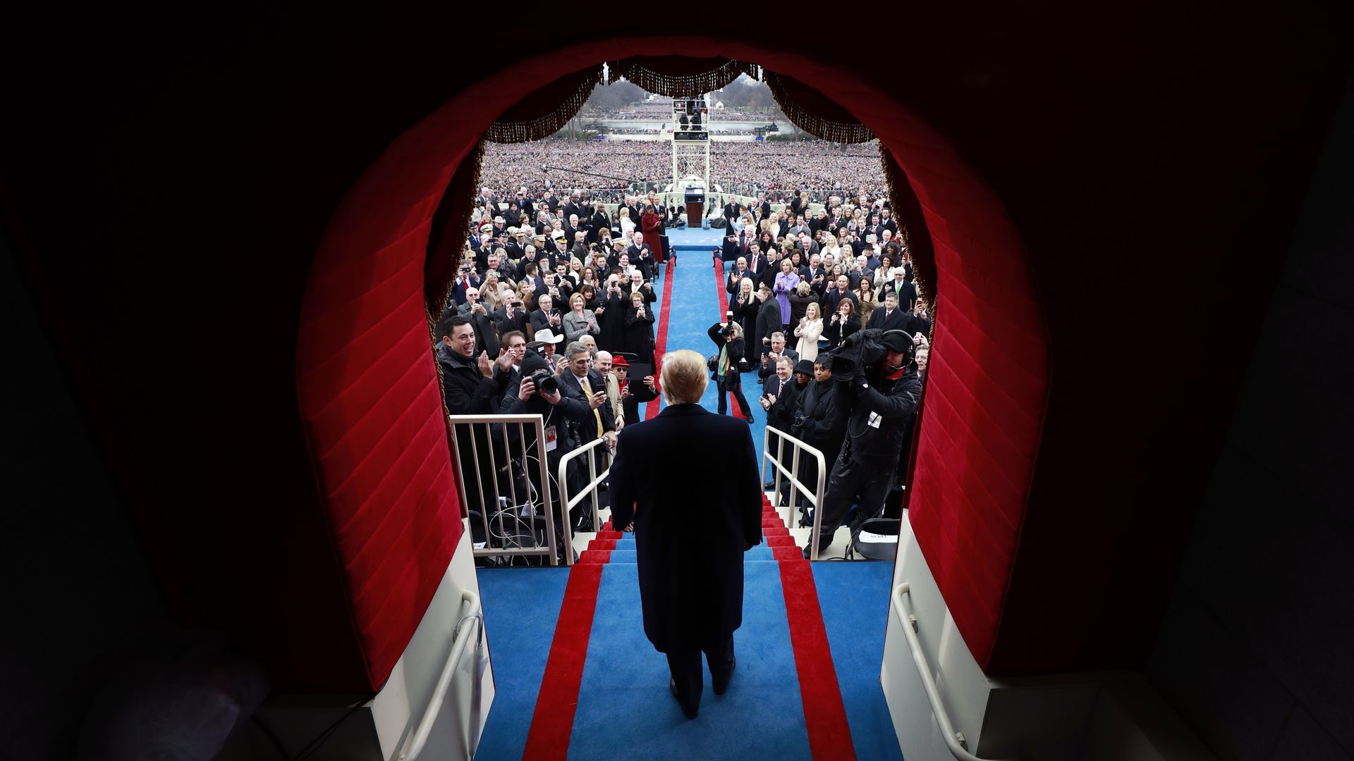 In this image, Trump walks through a tunnel at the Capitol to be sworn in as president.