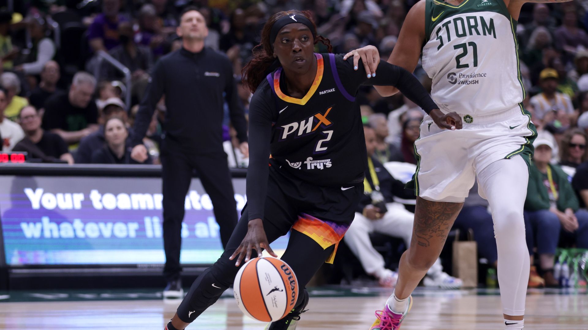 Kahleah Copper drives past a defender with the basketball. 