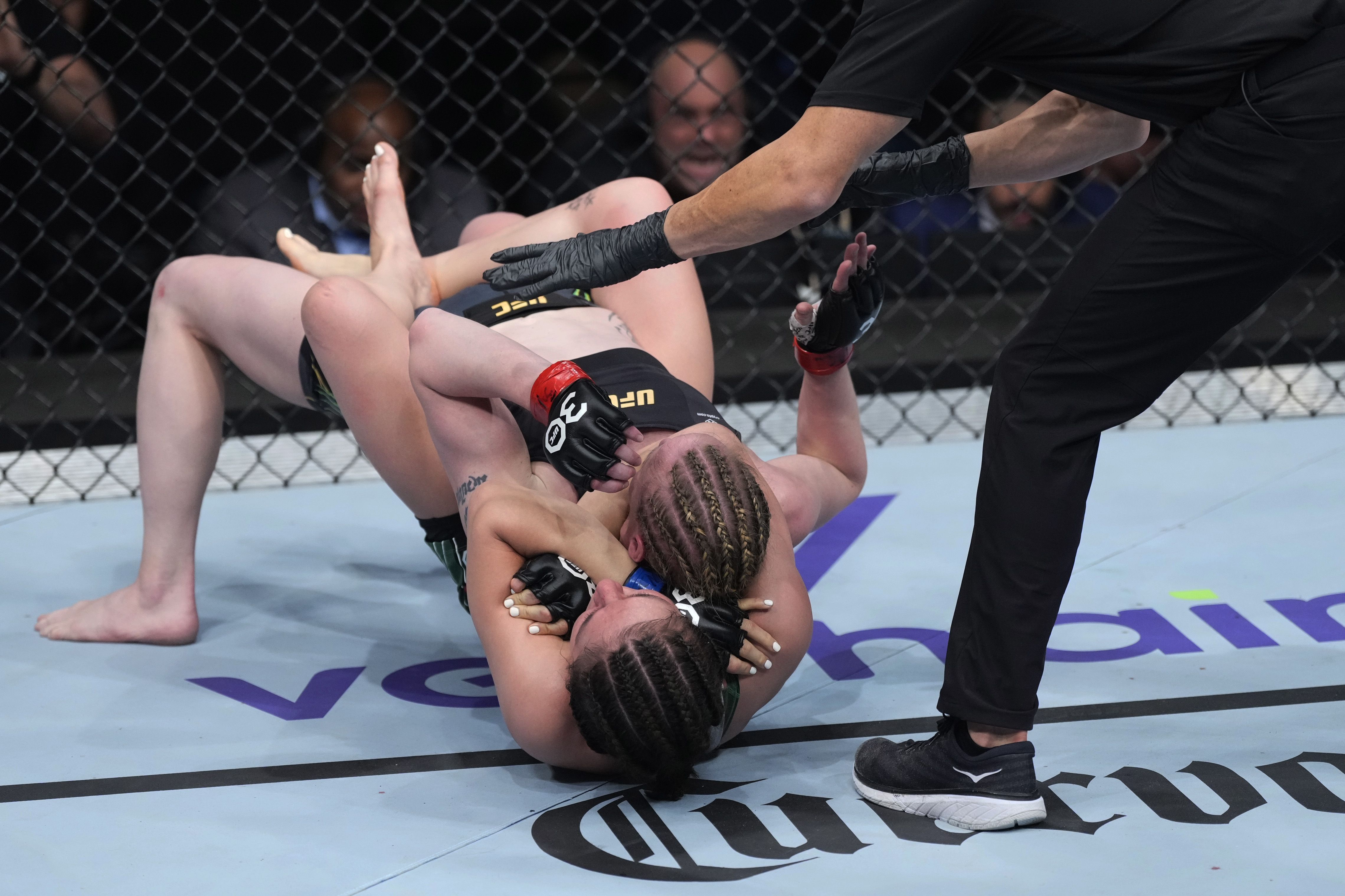 Alexa Grasso of Mexico chokes Valentina Shevchenko of Kyrgyzstan in the UFC flyweight championship fight during the UFC 285 event at T-Mobile Arena on March 04, 2023 in Las Vegas, Nevada. 