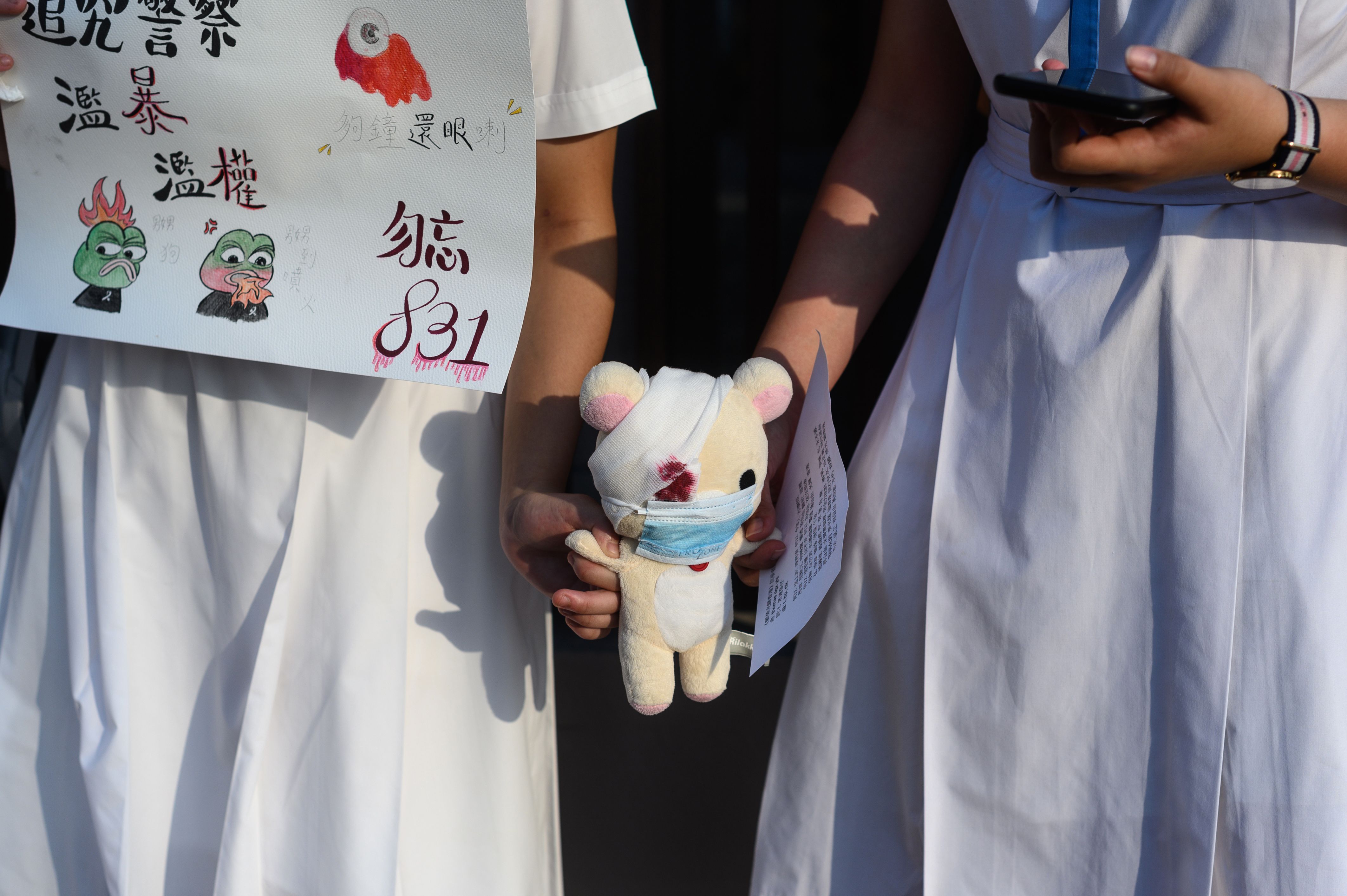 High school students and alumni form a human chain during a rally in the Sha Tin district of Hong Kong 