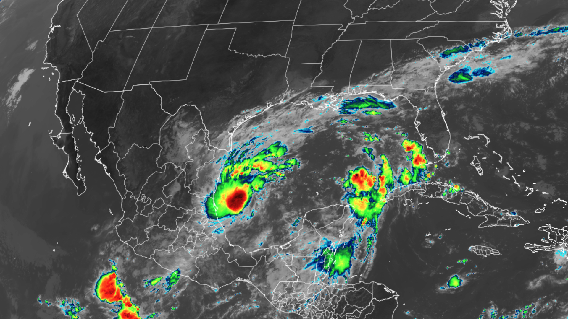 Satellite image shows developing Tropical Storm Milton nestled in the southwestern Gulf of Mexico, with the highest and coldest cloud tops showing up as red and black.