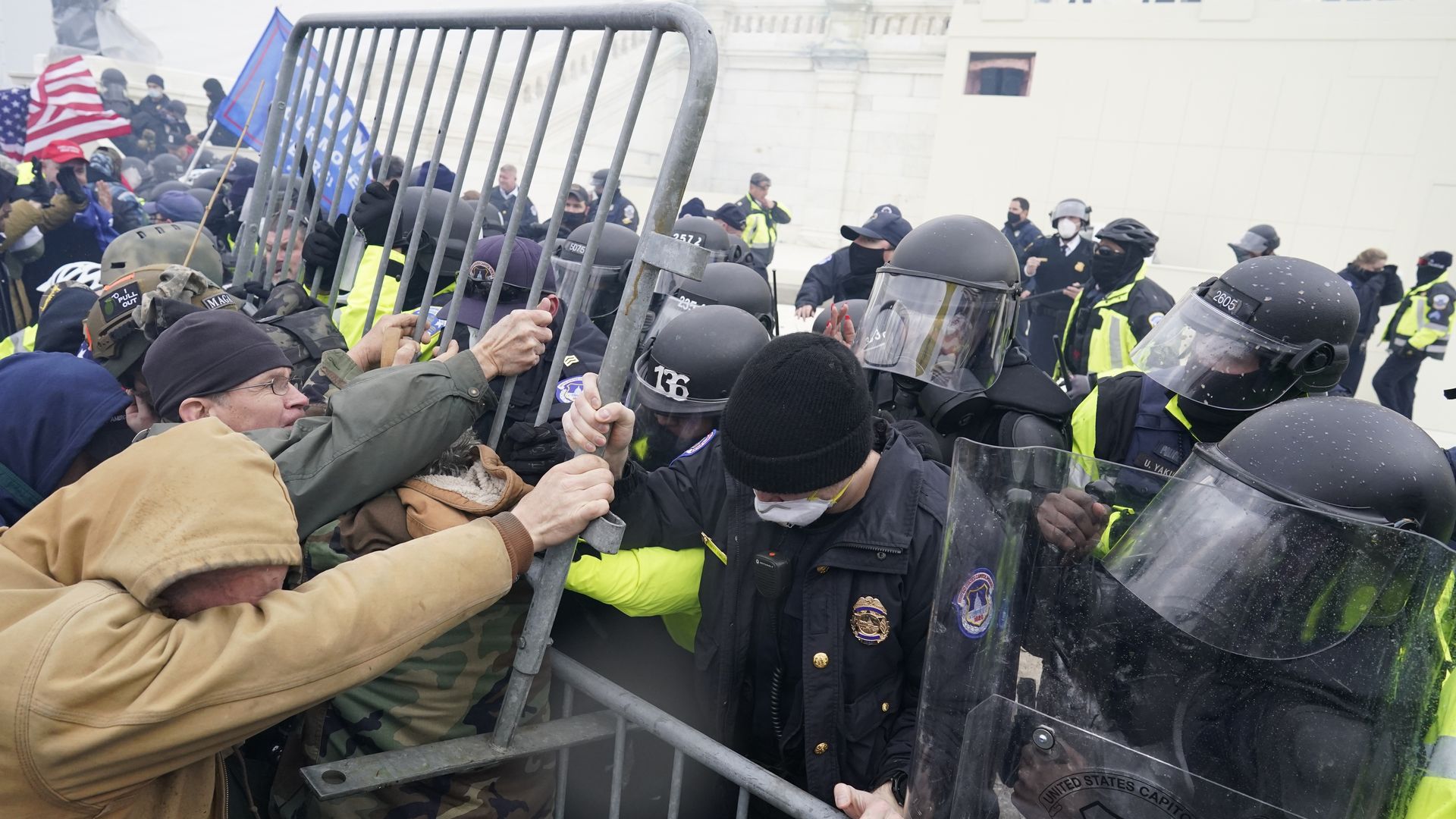  Police try to hold back protesters who gather storm the Capitol and halt a joint session of the 117th Congress on Wednesday, Jan. 6, 2021 in Washington, DC. 