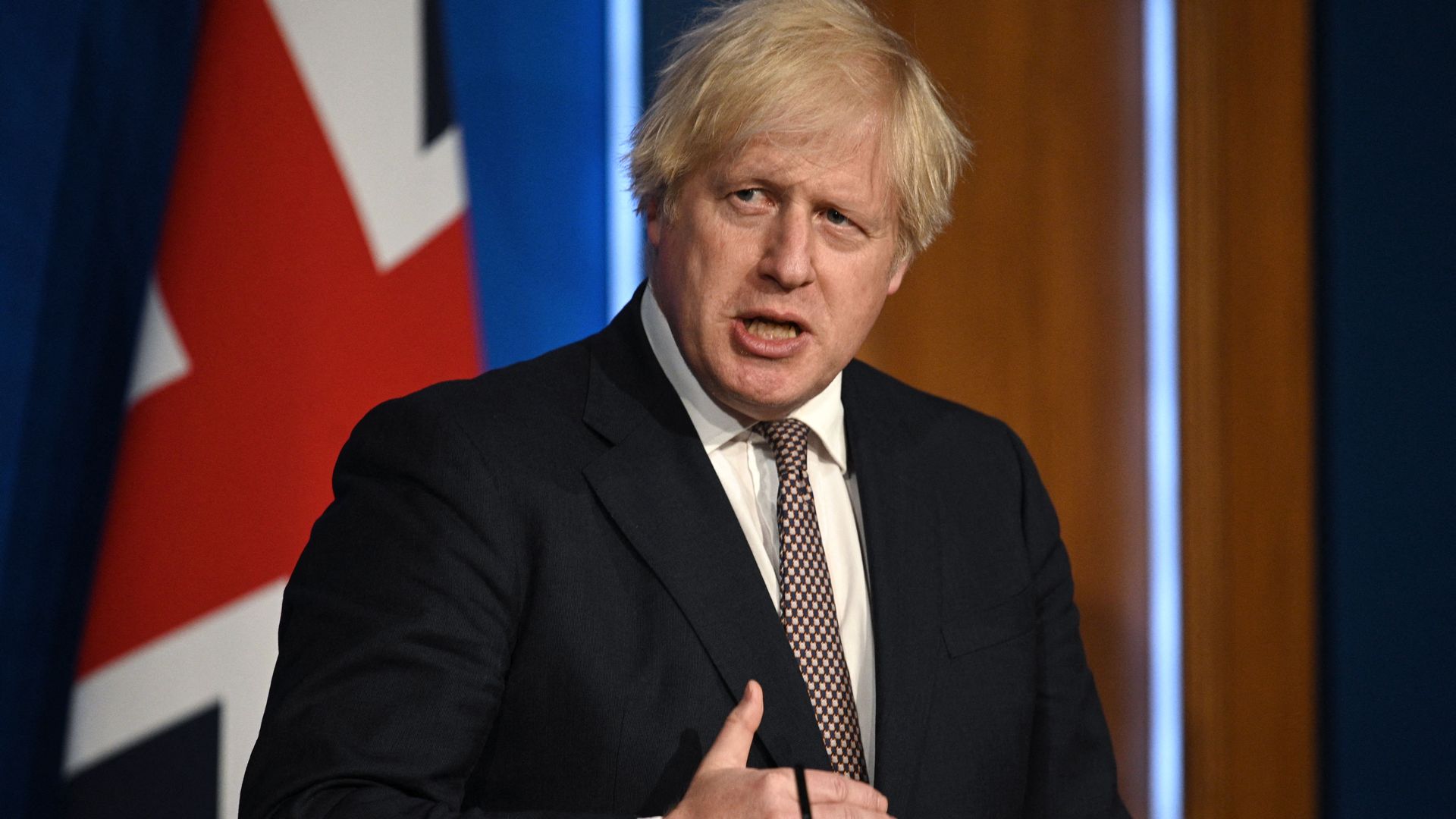 Boris Johnson speaks at a podium.