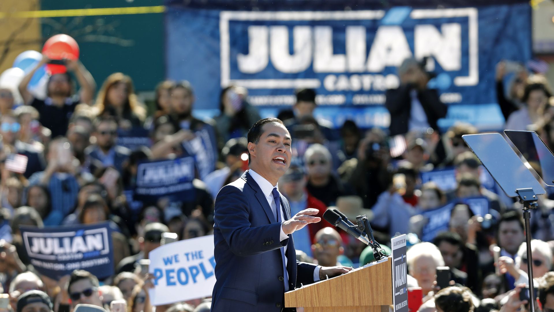 Julián Castro speaks from behind a podium at a campaign event