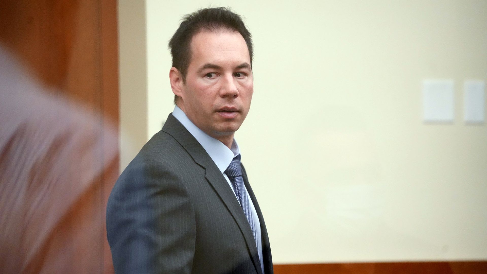 William Husel stands at his trial