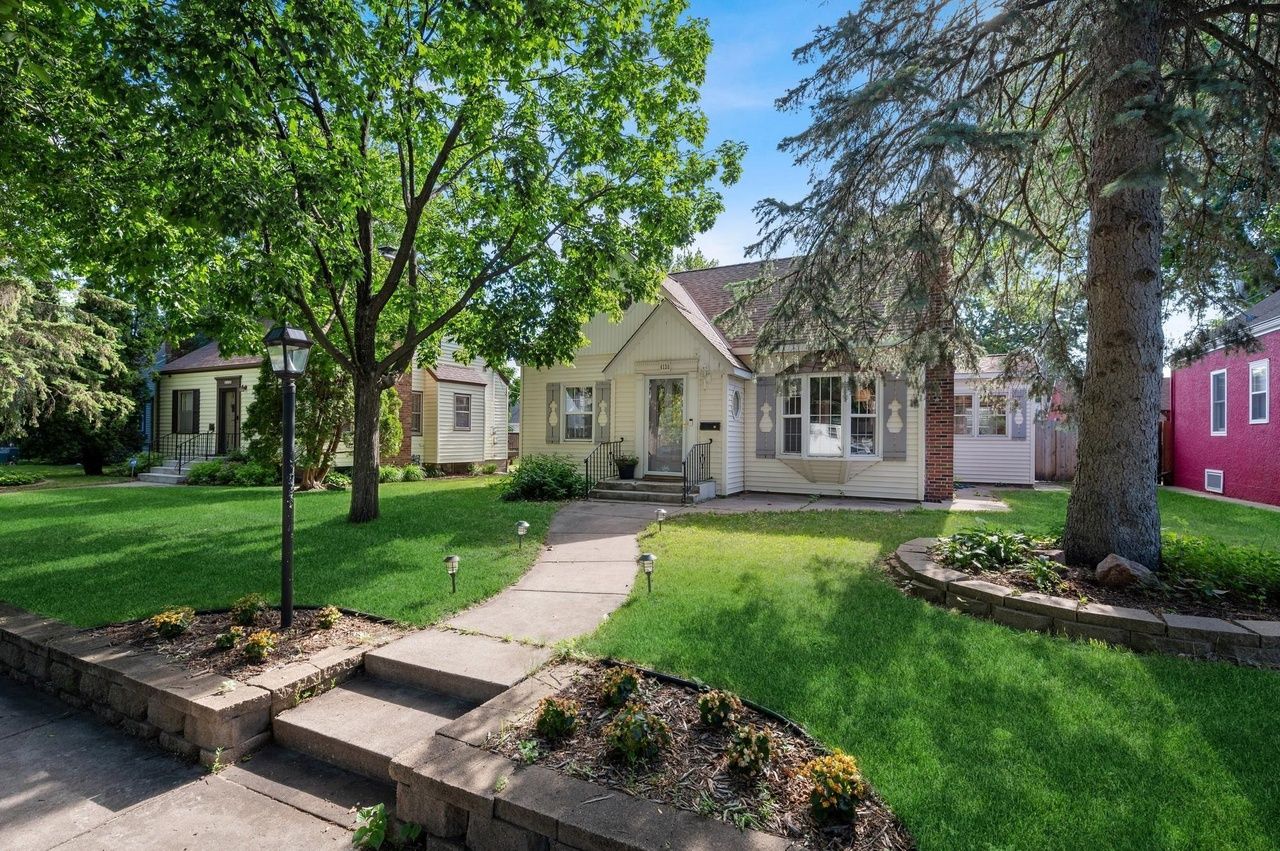 house tucked in yard among trees