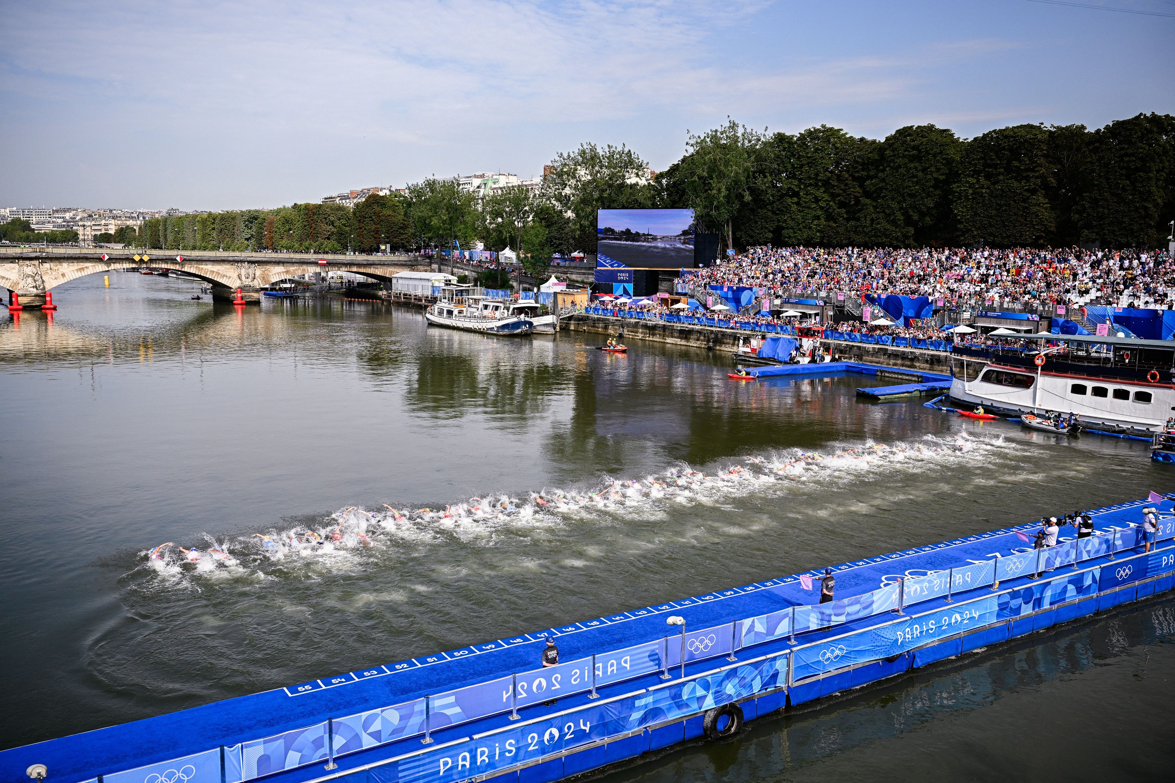 Athletes swim in th Seine during the men's individual triathlon race at the Paris 2024 Olympic Games, on Wednesday 31