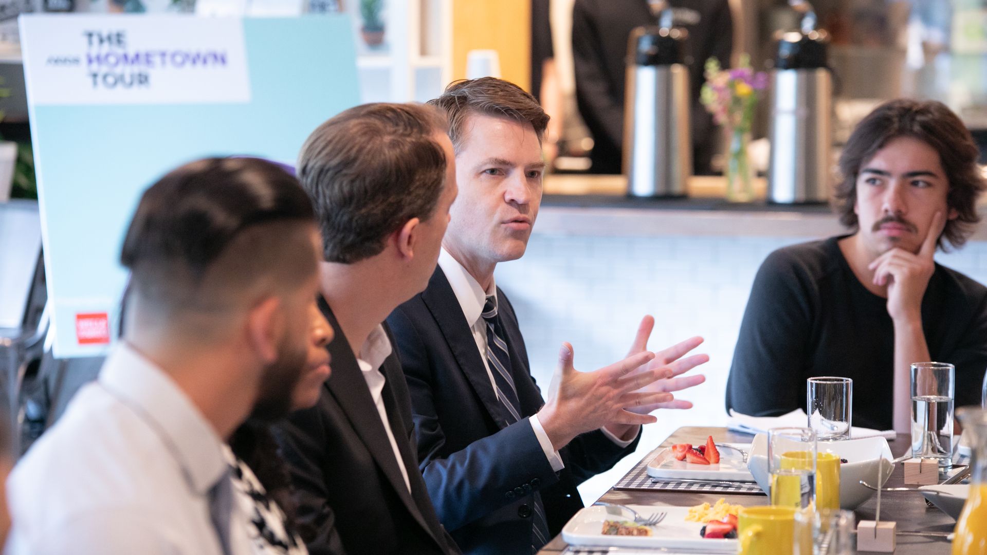 Roundtable participants sit down for the breakfast discussion.