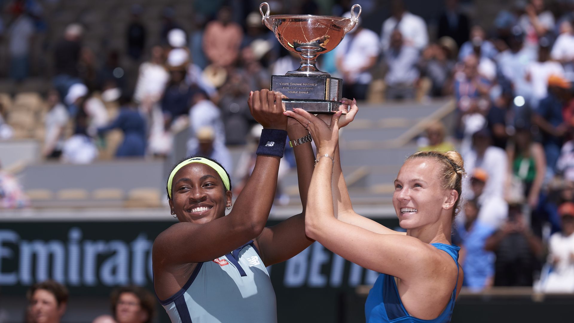 PARIS, FRANCE - JUNE 09: Coco Gauff of United States and Katerina Siniakova of Czechia celebrate with the trophy after victory against Jasmine Paolini of Italy and Sara Errani of Italy in the Women's Doubles Final match on Day 15 of the 2024 French Open at Roland Garros on June 09, 2024 in Paris, Fr