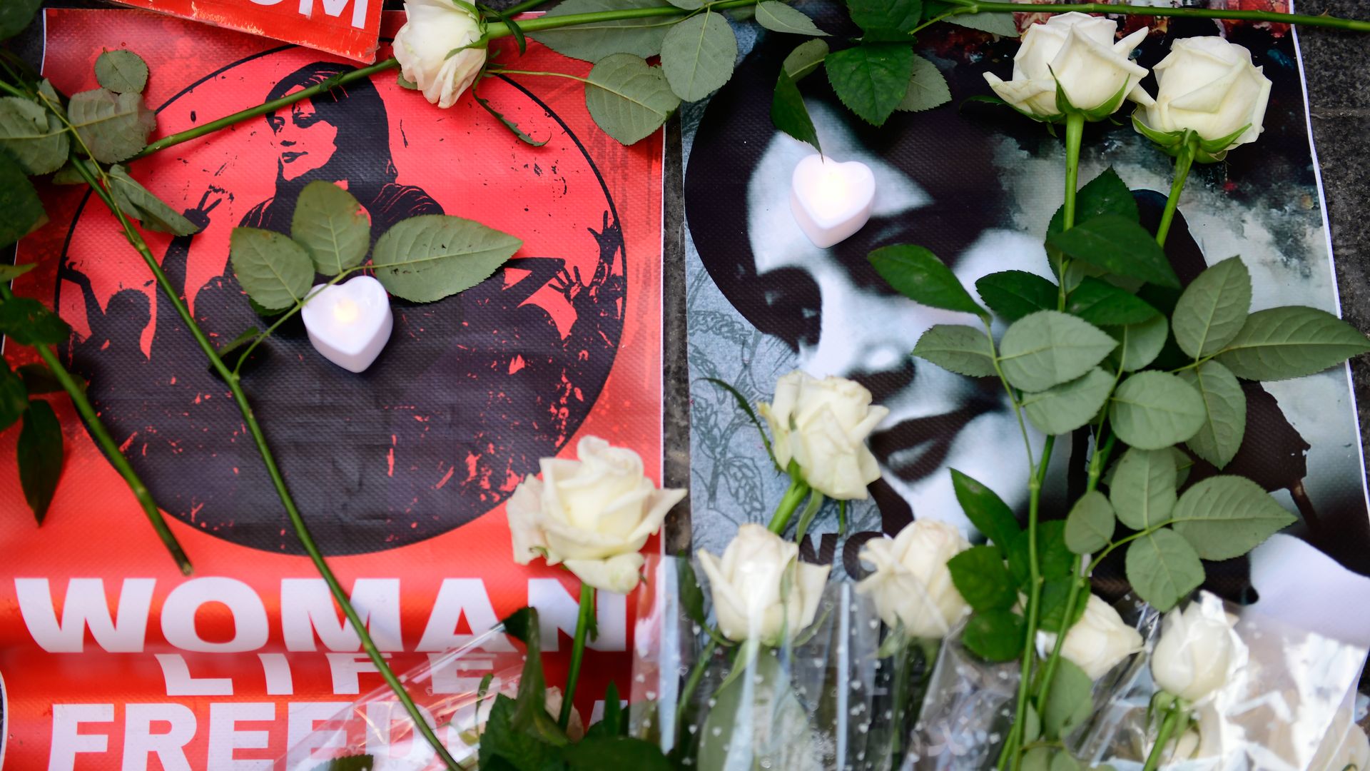 signs at a protest at the Iranian consulate on October 31, 2022 in İstanbul,