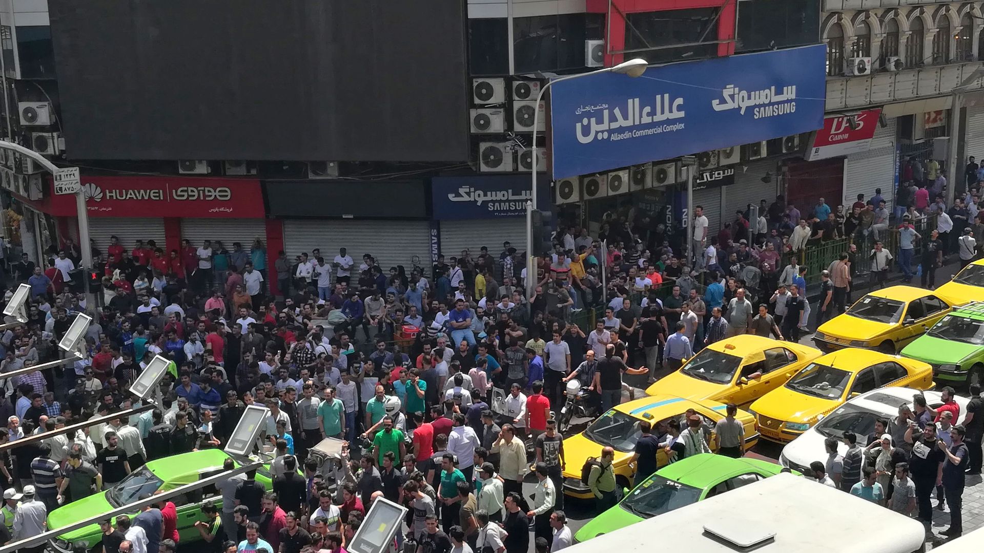 Iranian protesters shout slogans during a demonstration in central Tehran on June 25, 2018.
