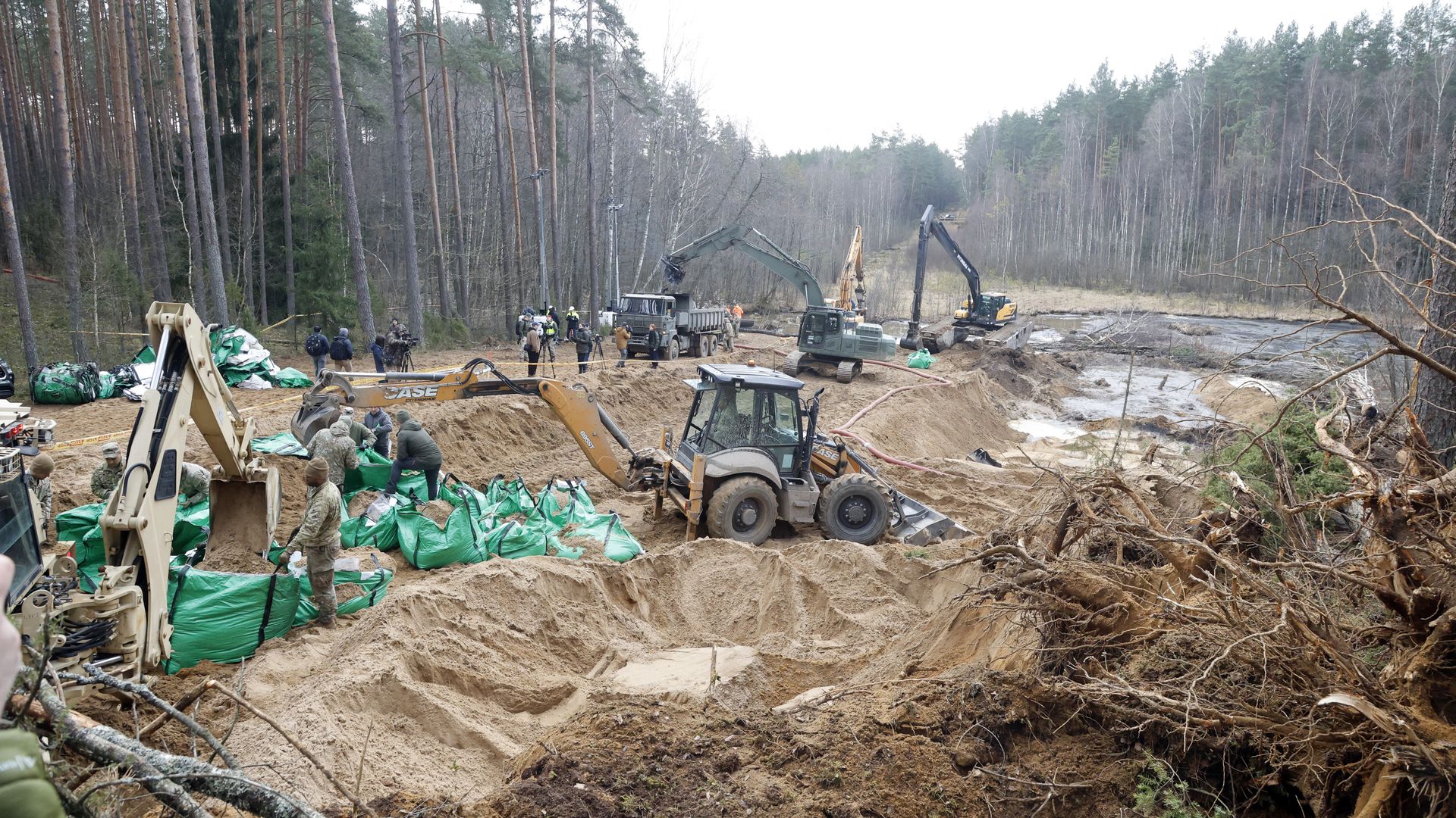 Military personnel work at the site of a rescue operation for missing US soldiers at Pabrade training ground, in Lithuania, on March 28, 