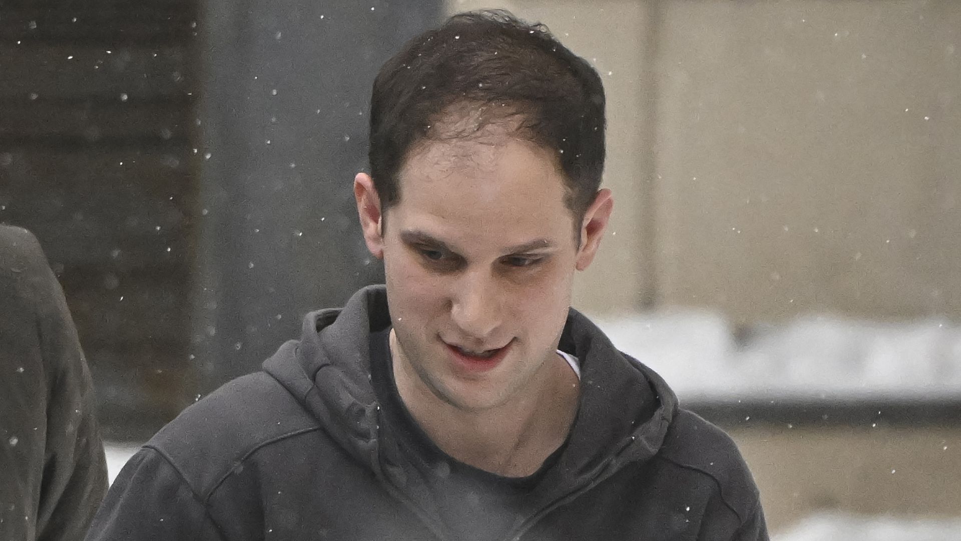 U.S. journalist Evan Gershkovich being escorted out of a Moscow court building on Jan. 26.