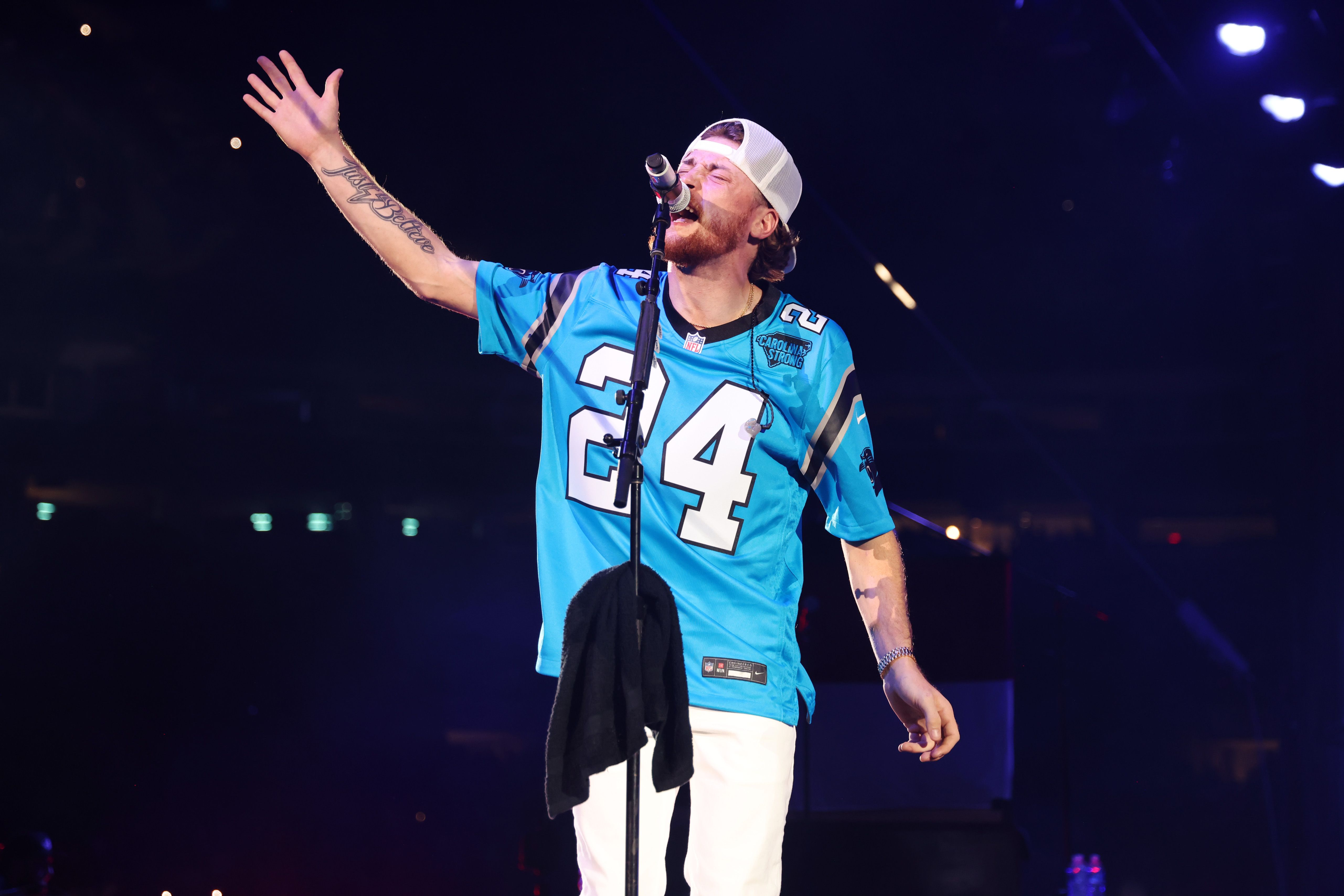 Bailey Zimmerman performing in a Panthers jersey.