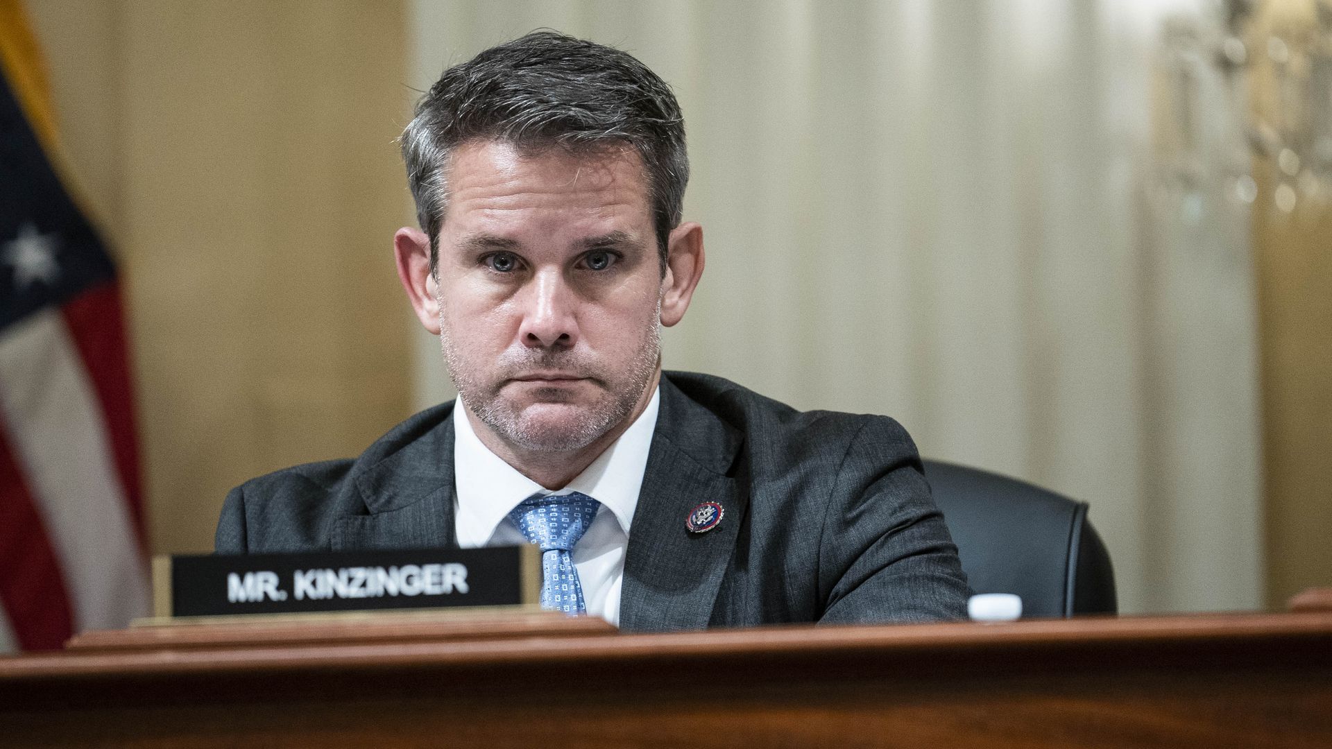 Adam Kinzinger looks straight at the camera.