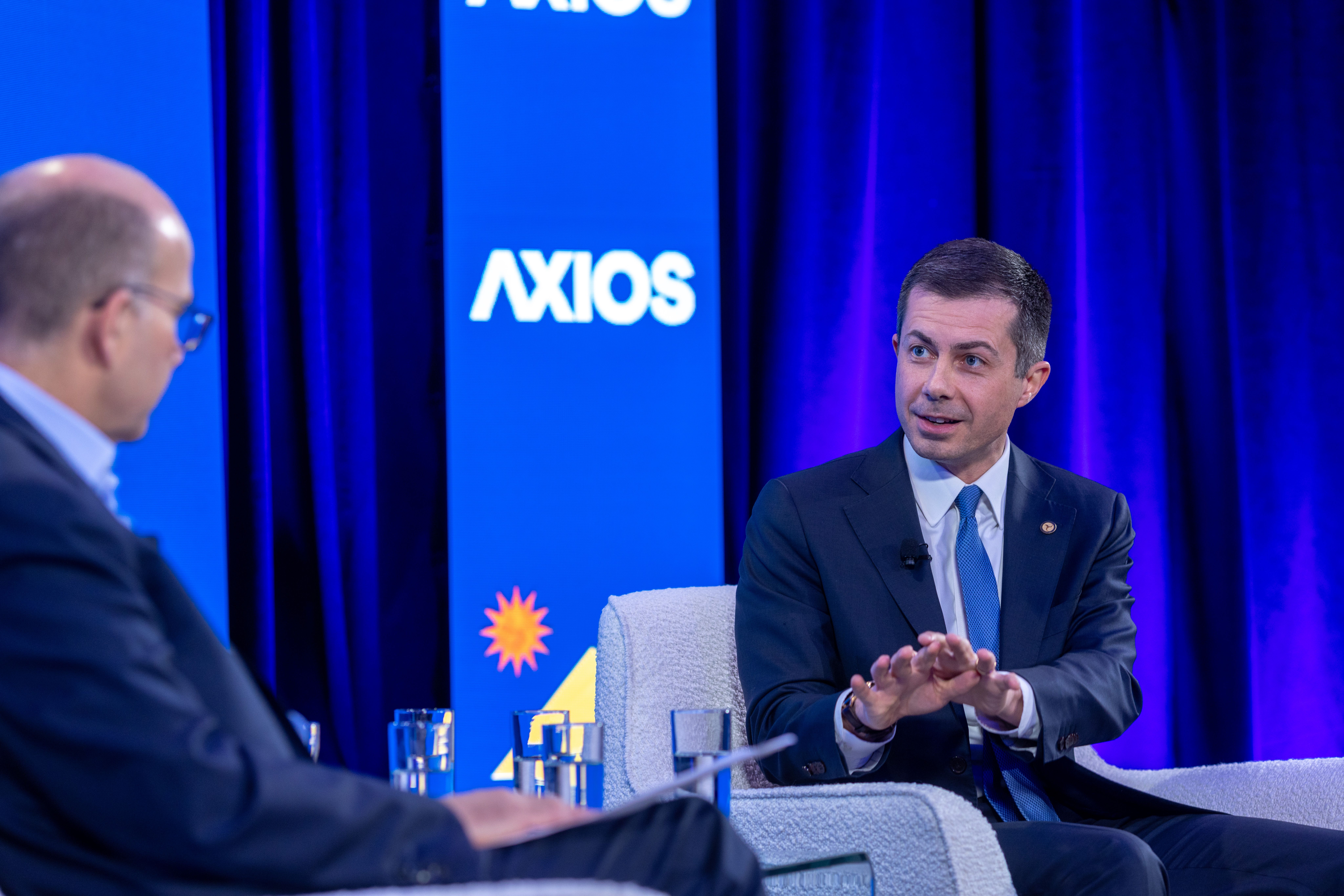Axios co-founder Mike Allen in conversation with Transportation Secretary Pete Buttigieg. Photo: Ronald Flores for Axios 