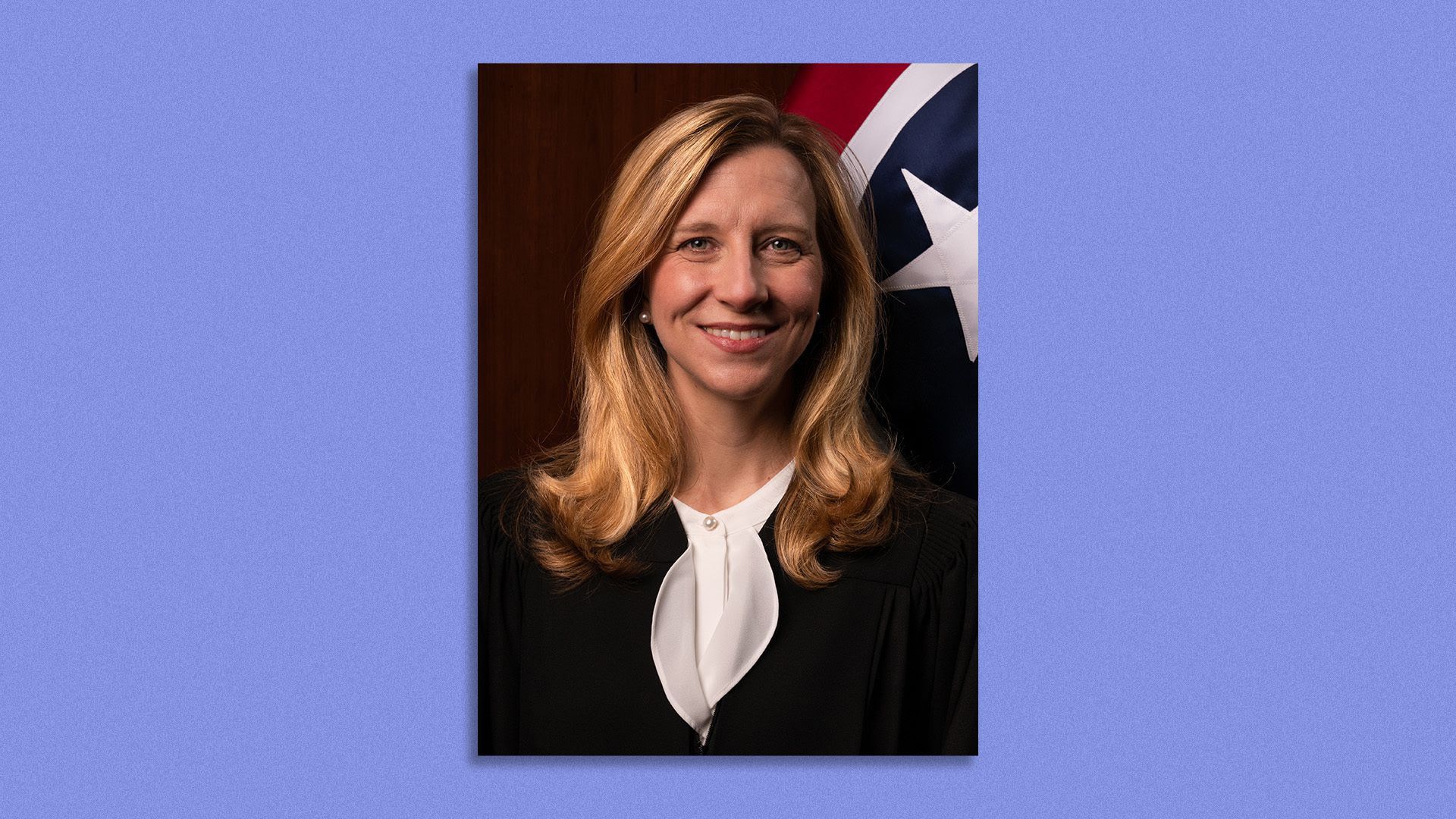 Sarah Keeton Campbell in front of the Tennessee state flag