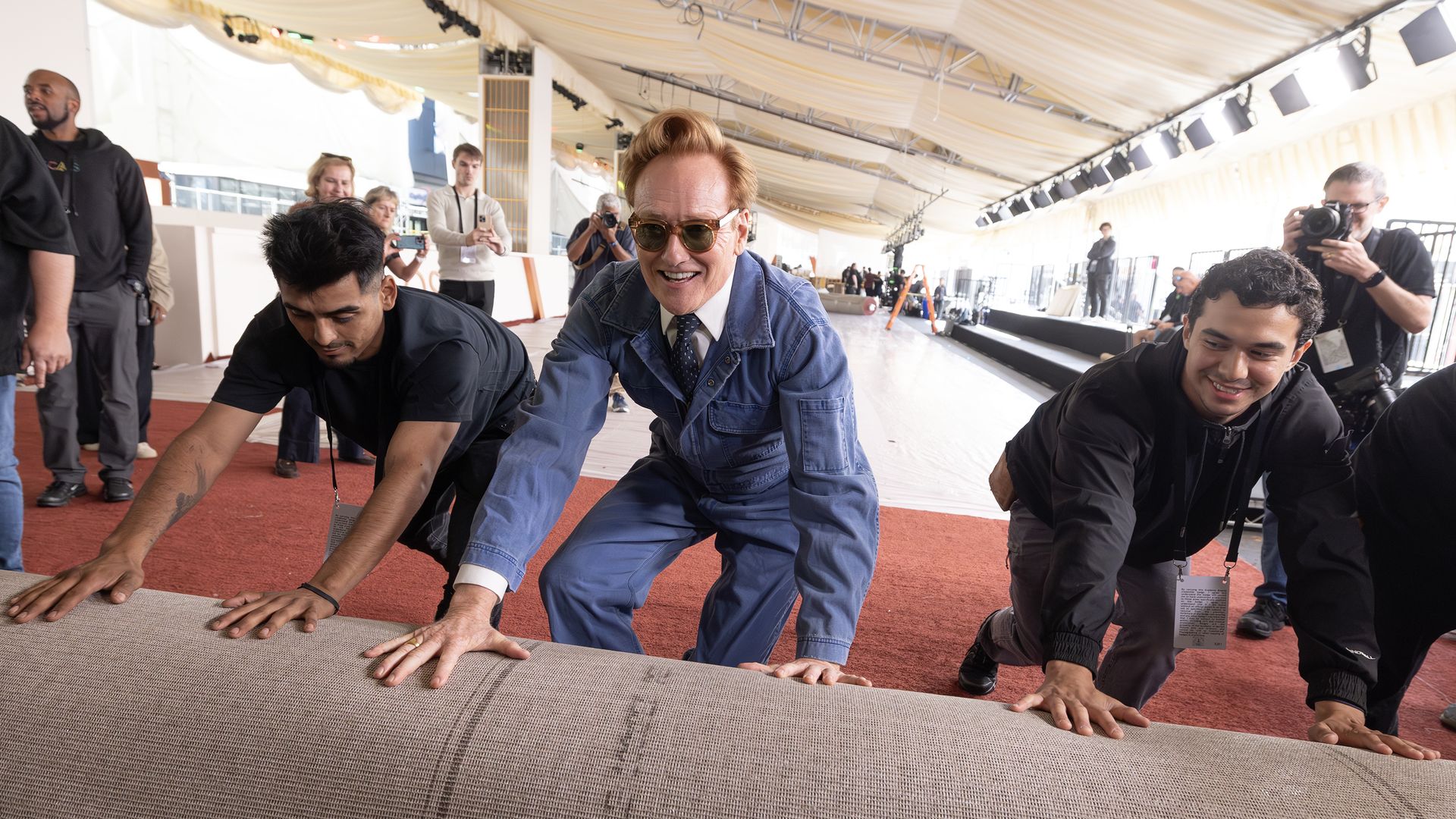 Oscars host Conan O'Brien helps rollout the red carpet ahead of the show's prep