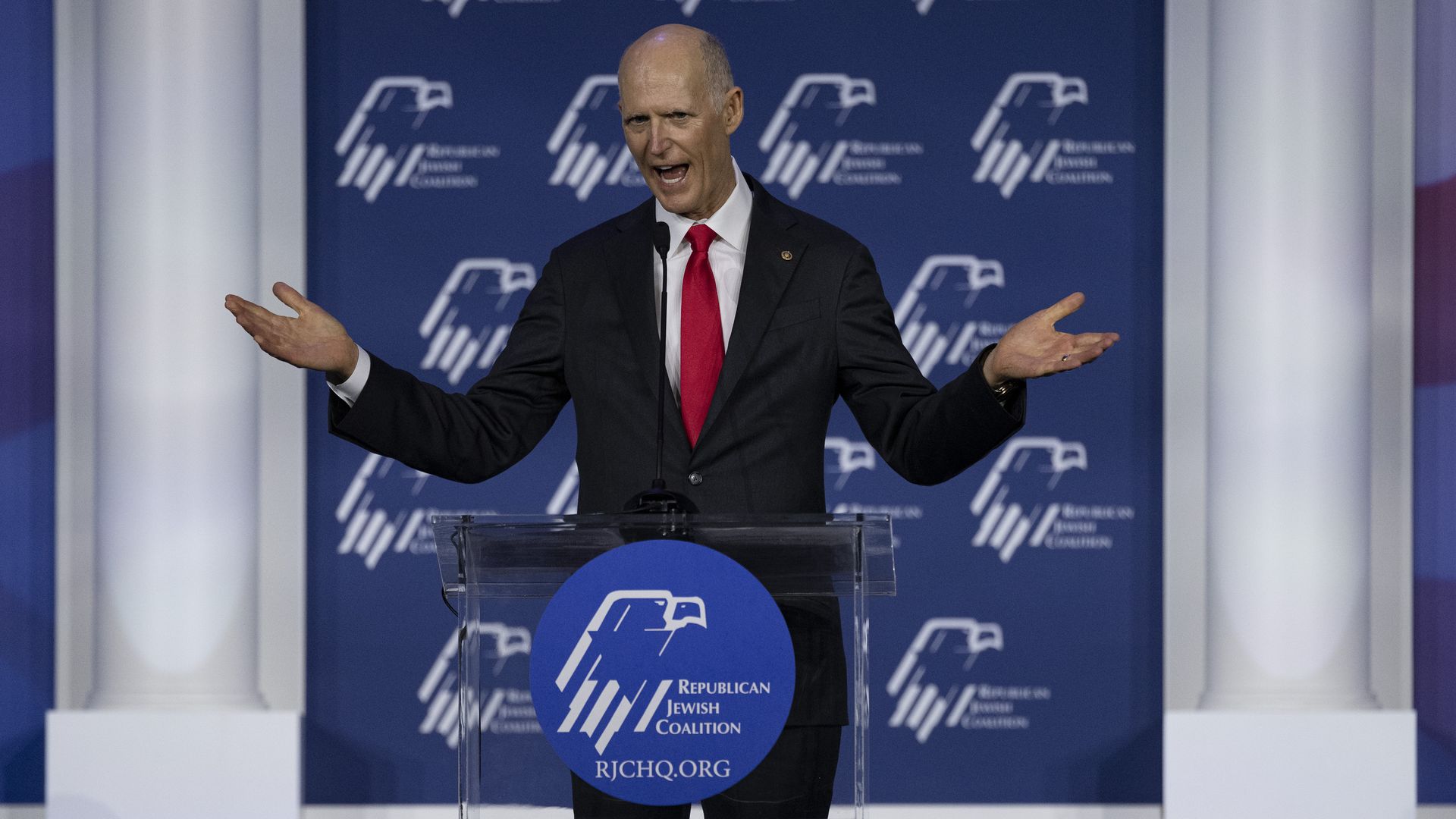 Sen. Rick Scott is seen delivering a speech.