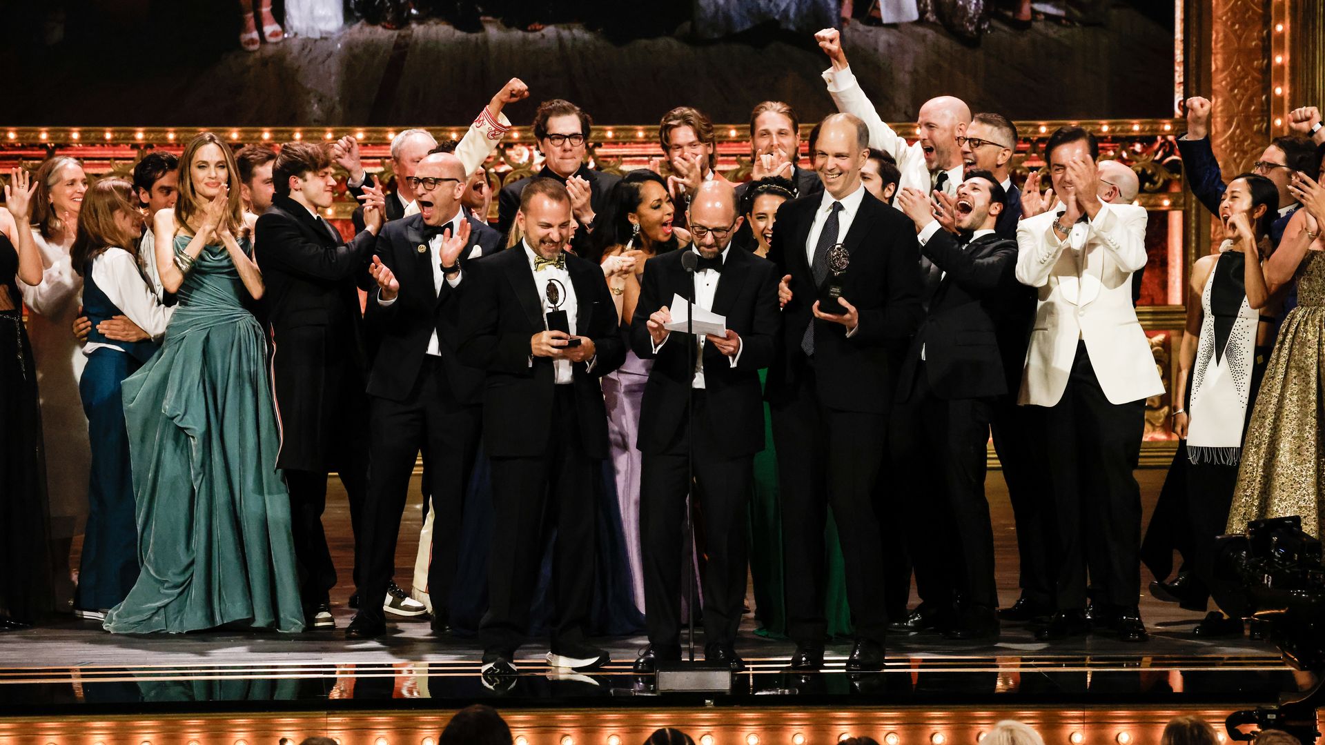 People celebrate on stage at the Tony Awards.