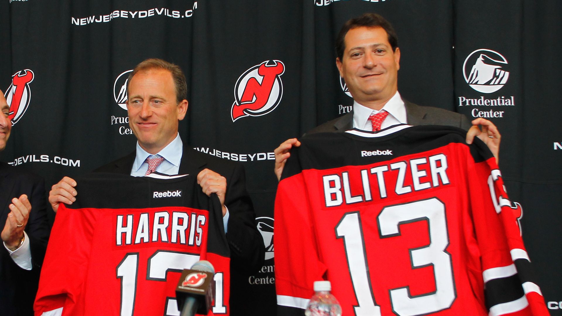harris and blitzer with devils jerseys