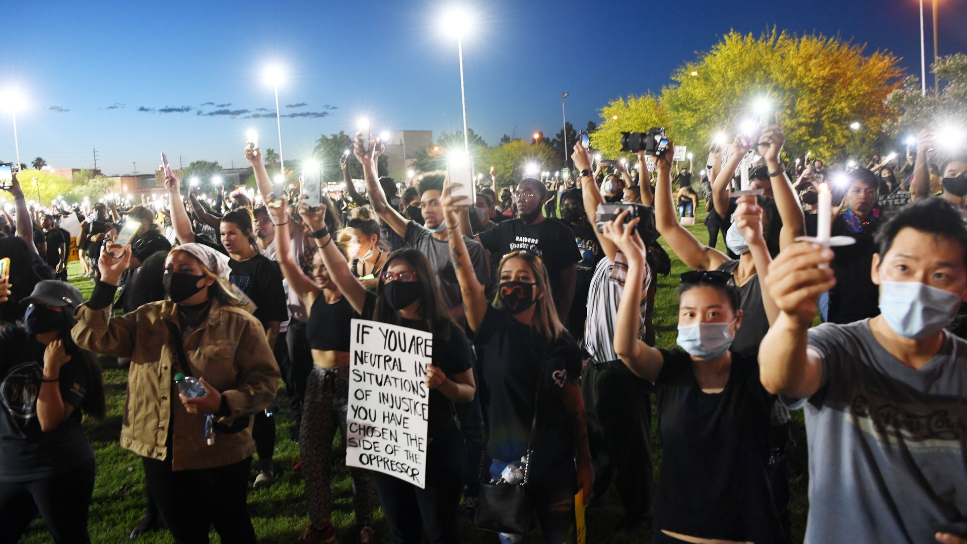Protesters gather at a rally and candlelight vigil in Las Vegas