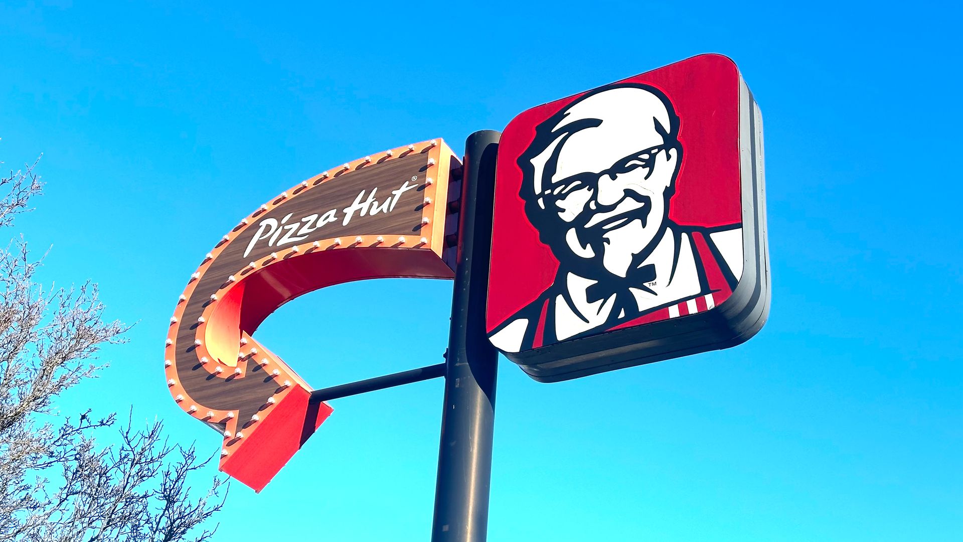 A sign advertising both Pizza Hut and KFC
