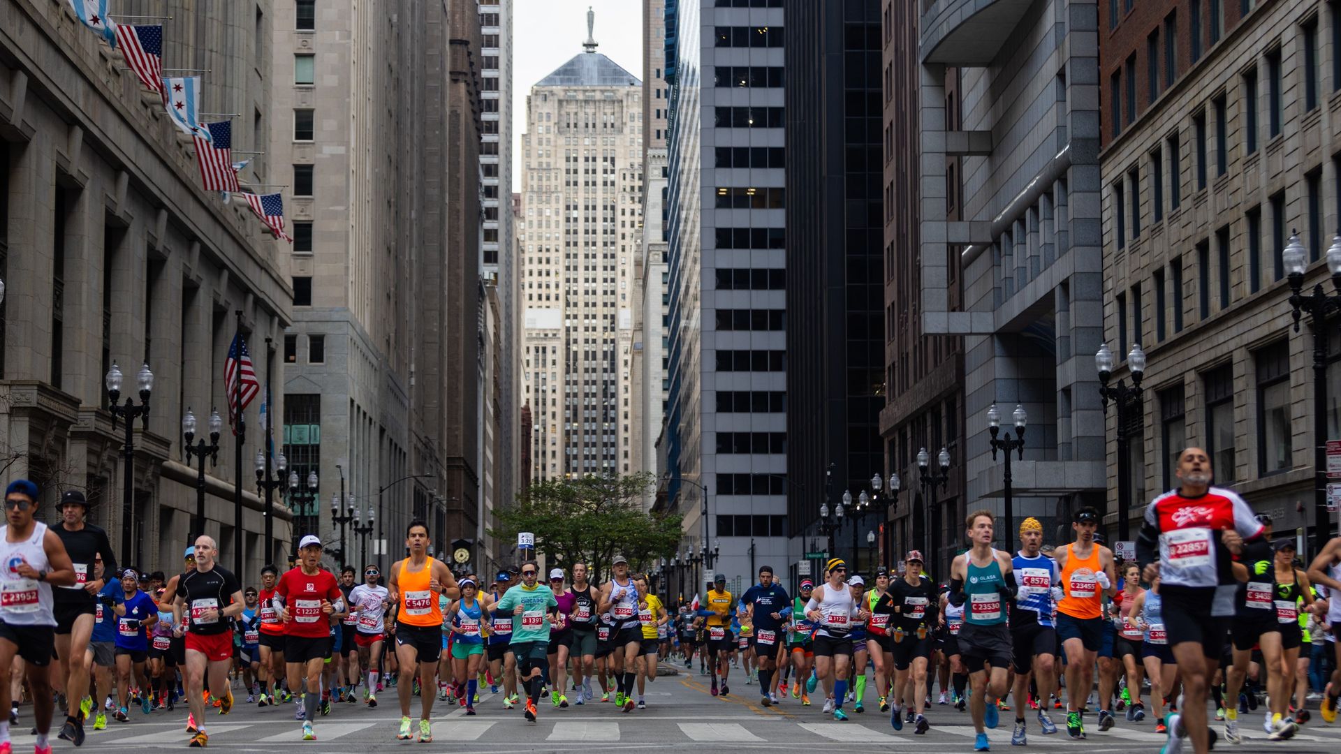 Photo of runners coming towards camera on a city street 