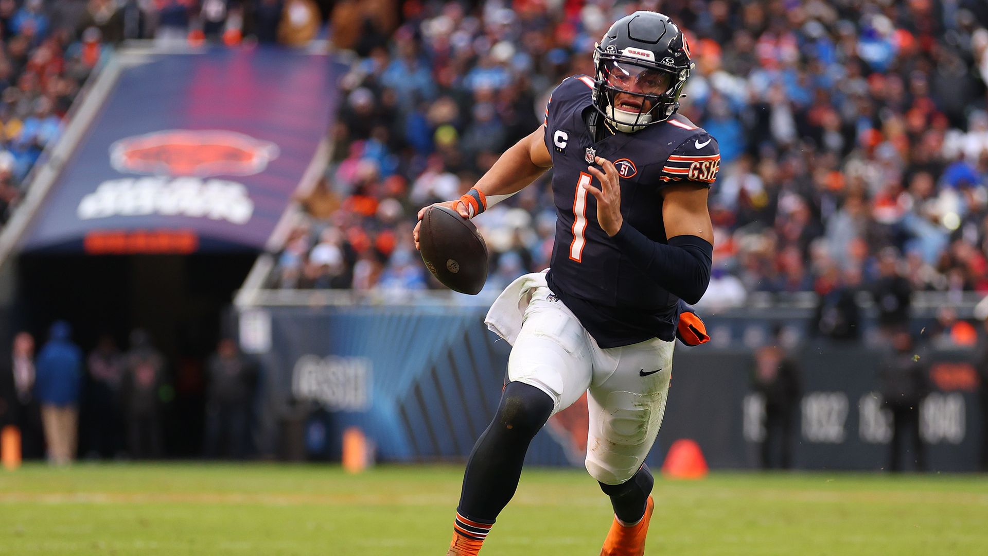 photo of a football player running 