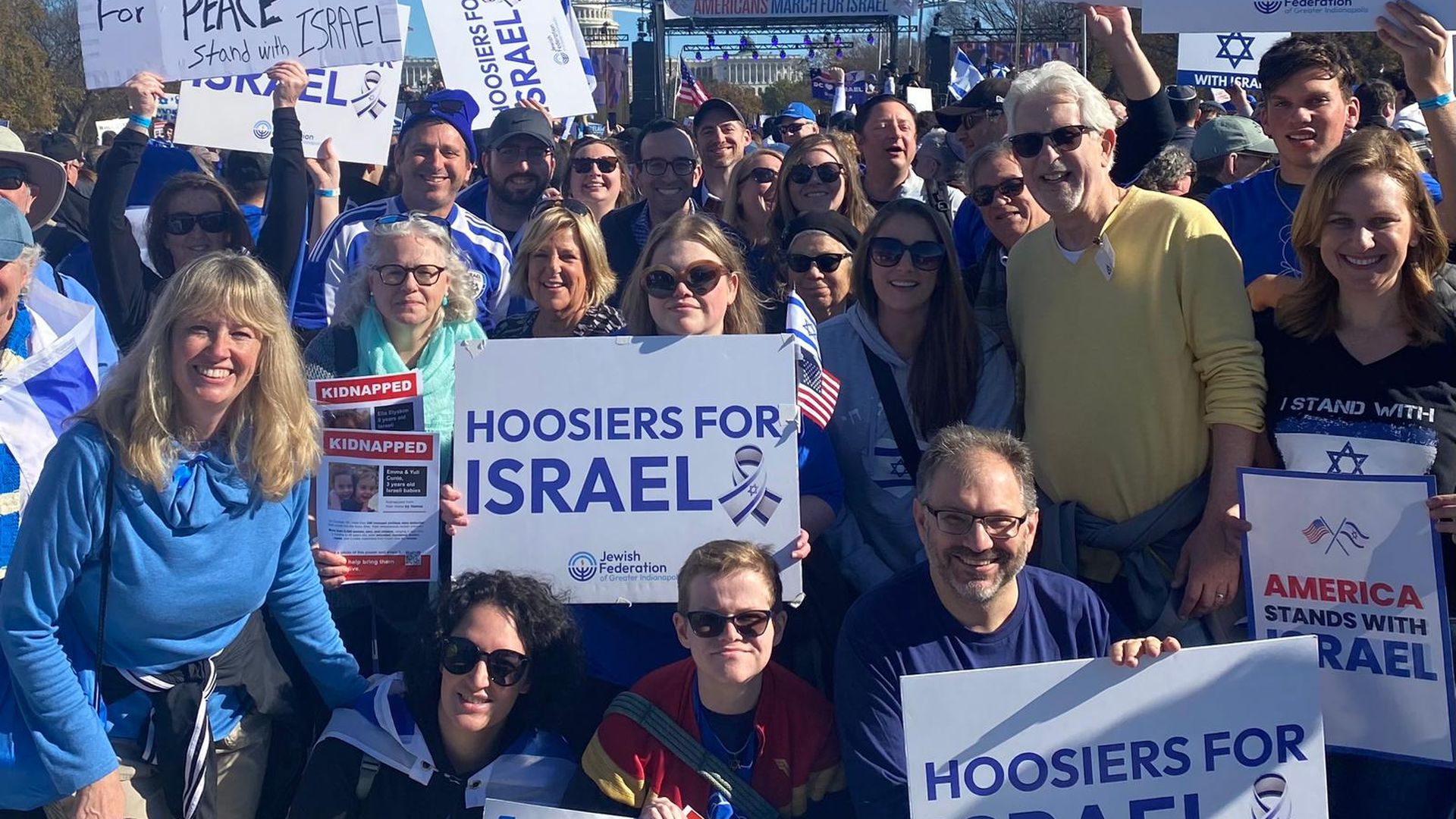 A group of people holding signs that say Hoosiers for Israel