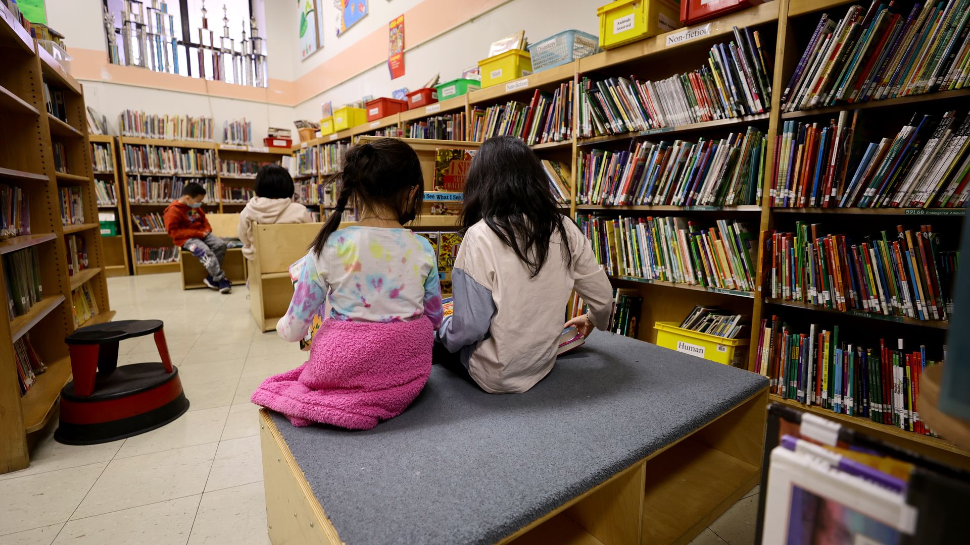 tudents in the library receive candy and red envelopes in a cultural celebration of the Lunar New Year at Yung Wing School P.S. 124 on February 02, 2022 in New York City