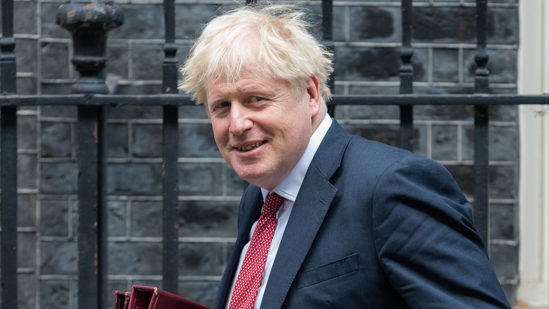 British Prime Minister Boris Johnson leaves 10 Downing Street for PMQs at the House of Commons on 02 September, 2020 in London, England.