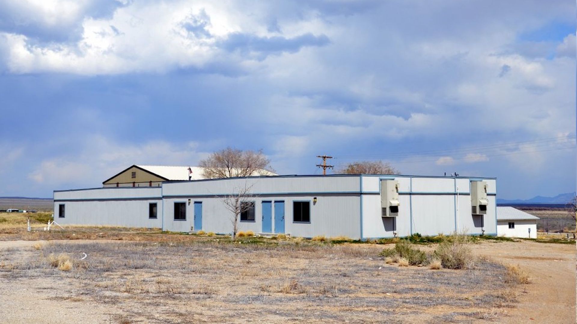 A white building in the desert.
