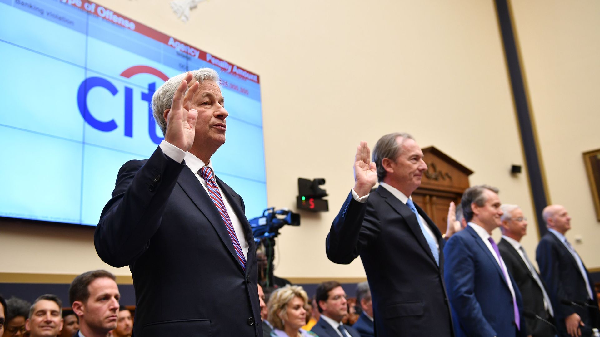 JP Morgan CEO James Dimon(L) and others are sworn in before they testify before the House Financial Services Committee