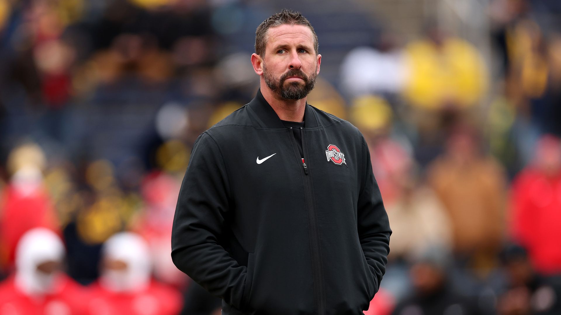 Offensive coordinator Brian Hartline of the Ohio State Buckeyes looks on before the game against the Michigan Wolverines at Michigan Stadium on November 29, 2025, in Ann Arbor, Michigan. 