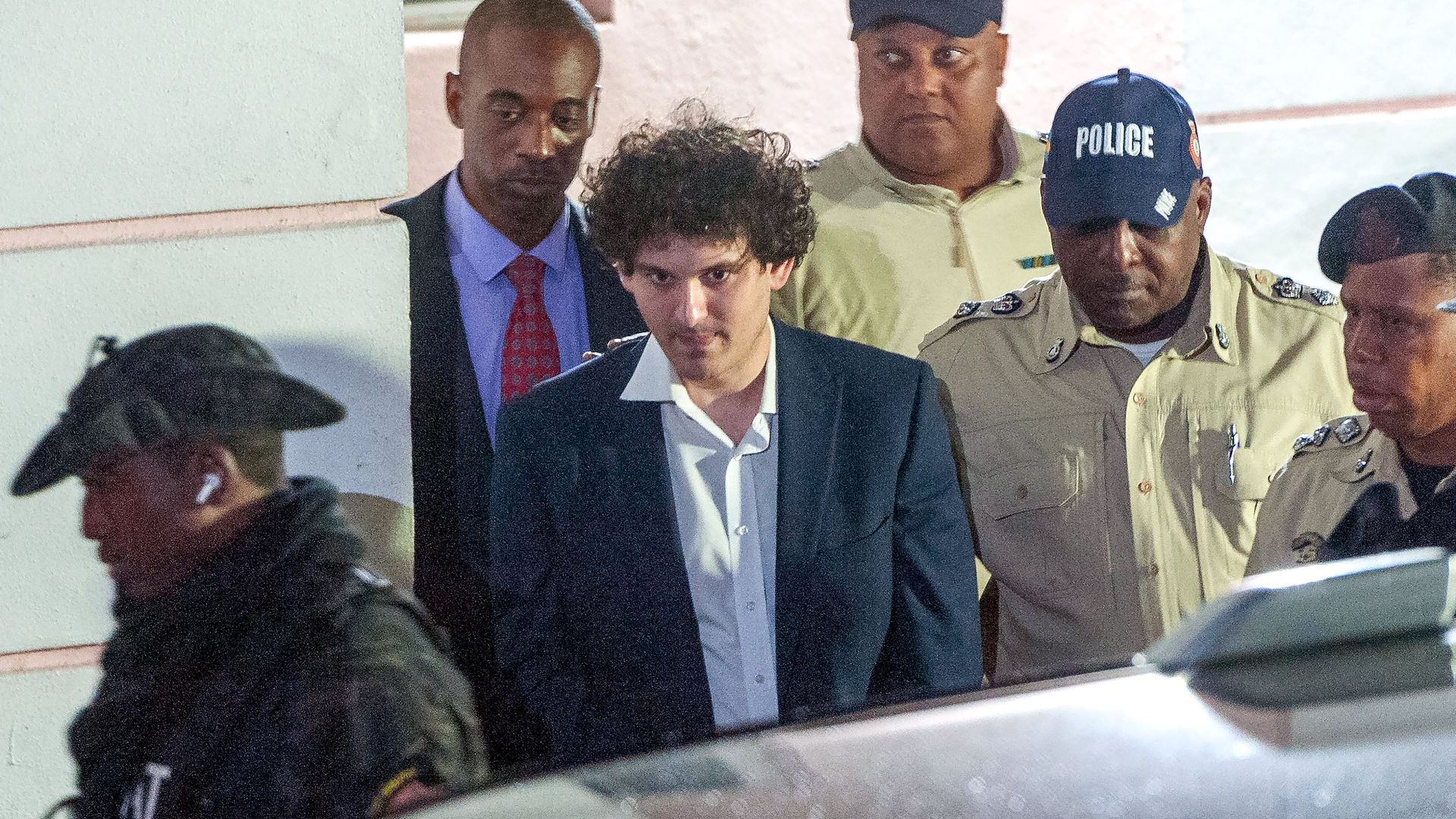 FTX founder Sam Bankman-Fried being led by officers in Nassau, Bahamas, on Dec. 13.