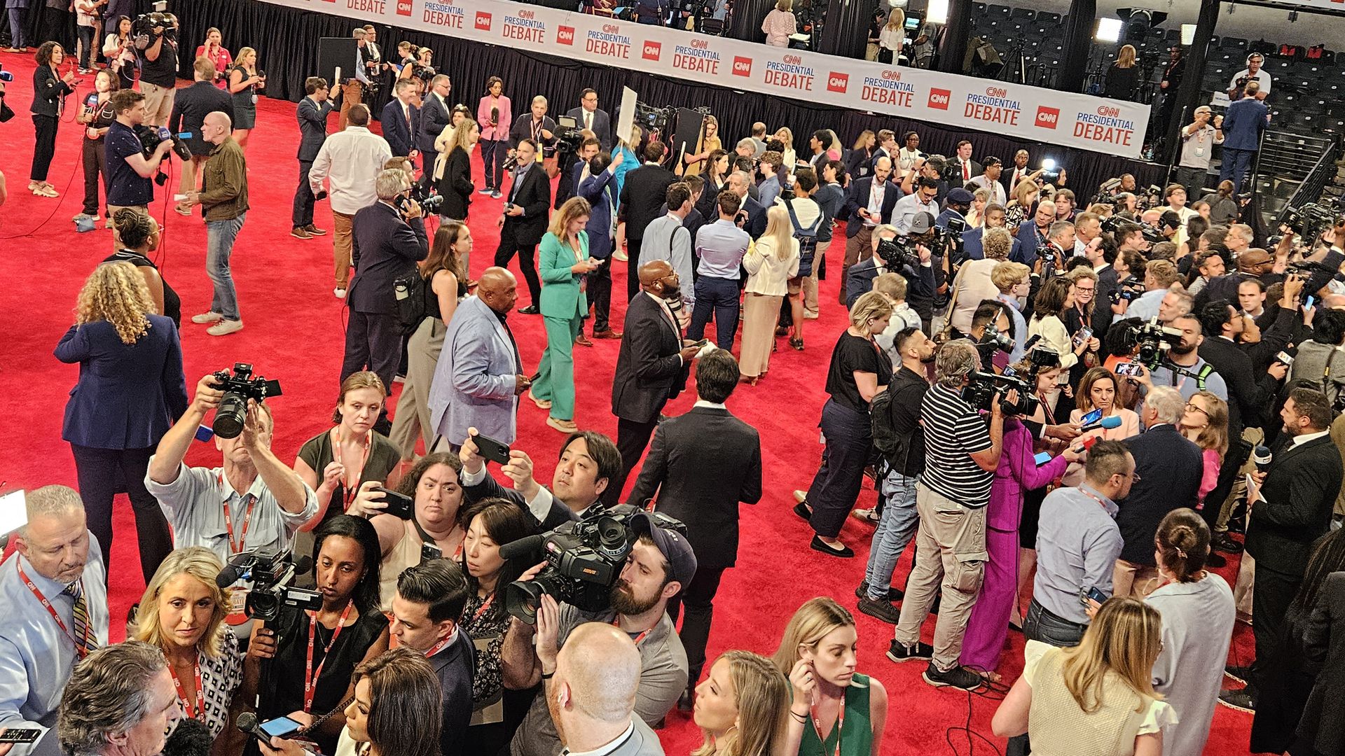 Reporters in the CNN spin room at McCamish Pavilion following the presidential debate.