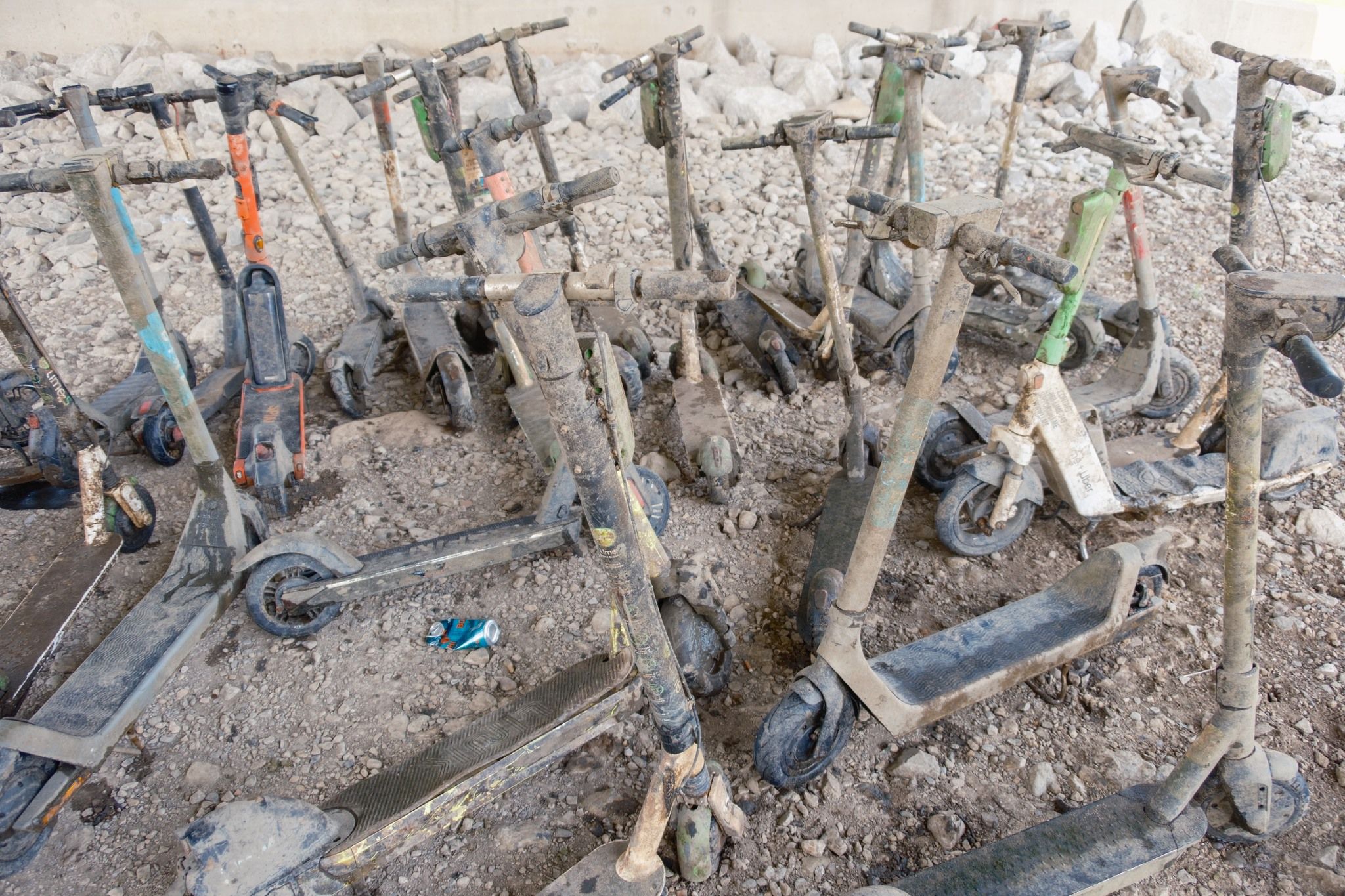 A pile of muddy electric scooters pulled from the Scioto River