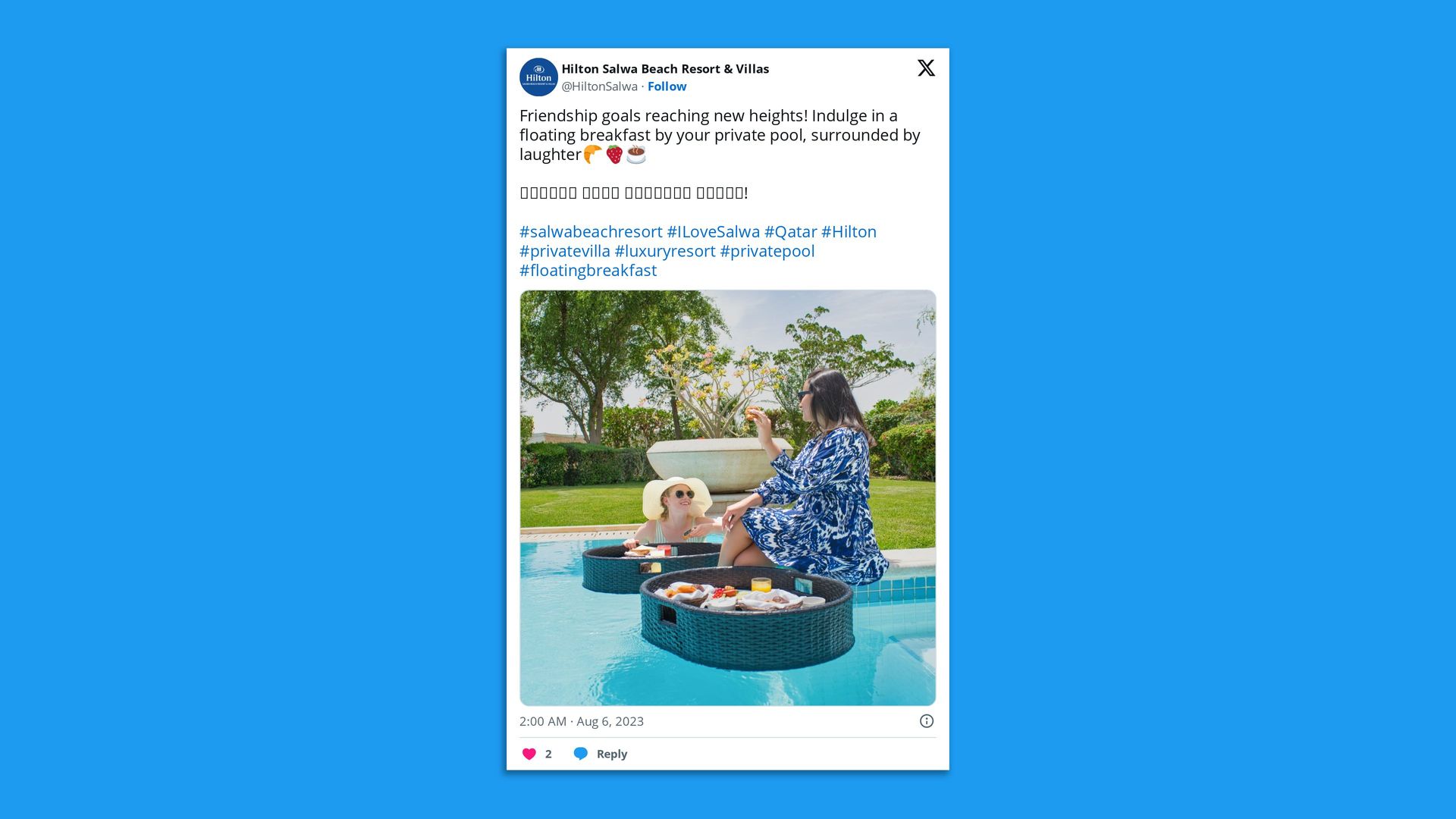 Screenshot of a tweet on X that shows two people eating breakfast from floating trays in a swimming pool.