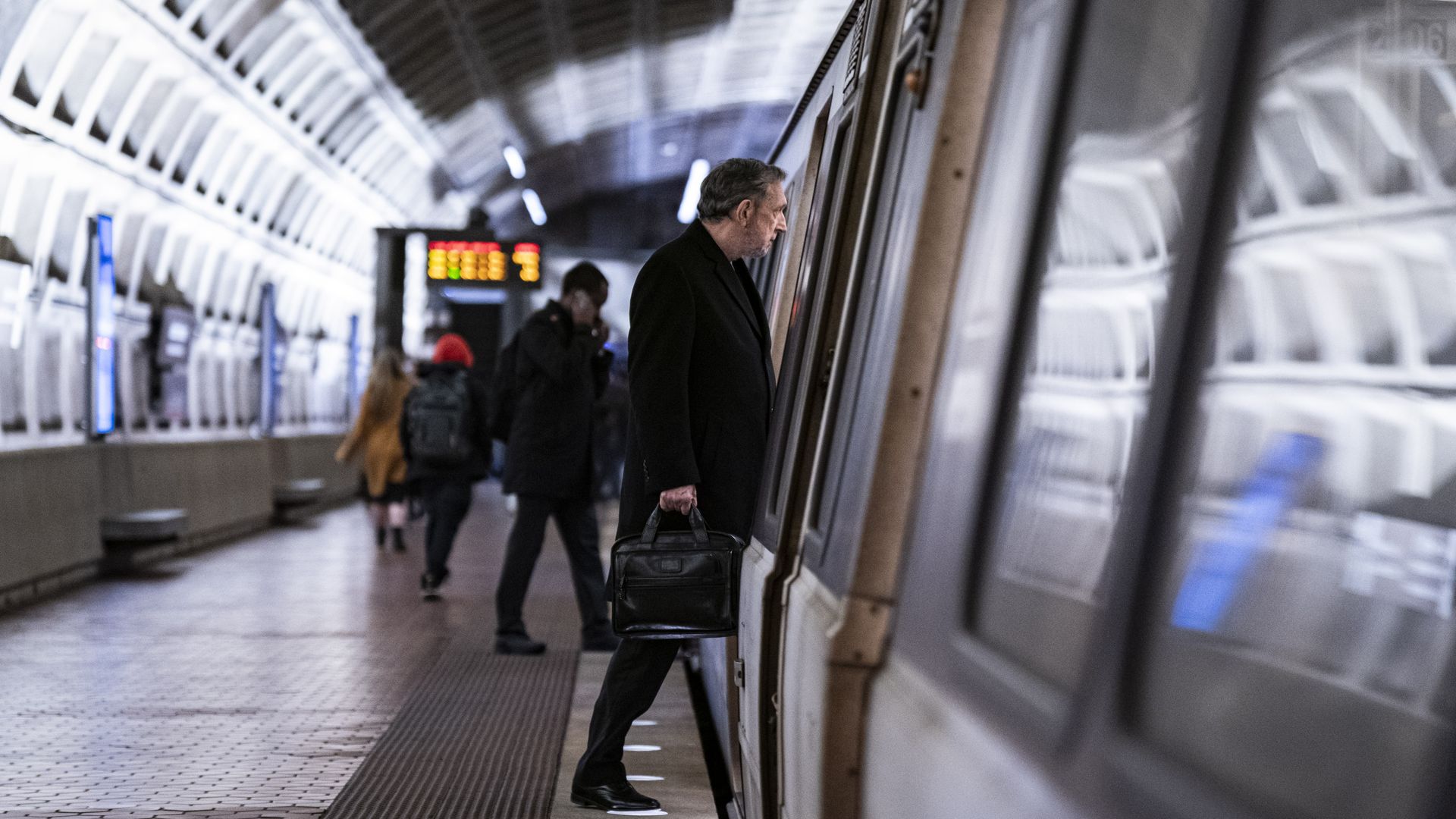 A man steps into a Metro train