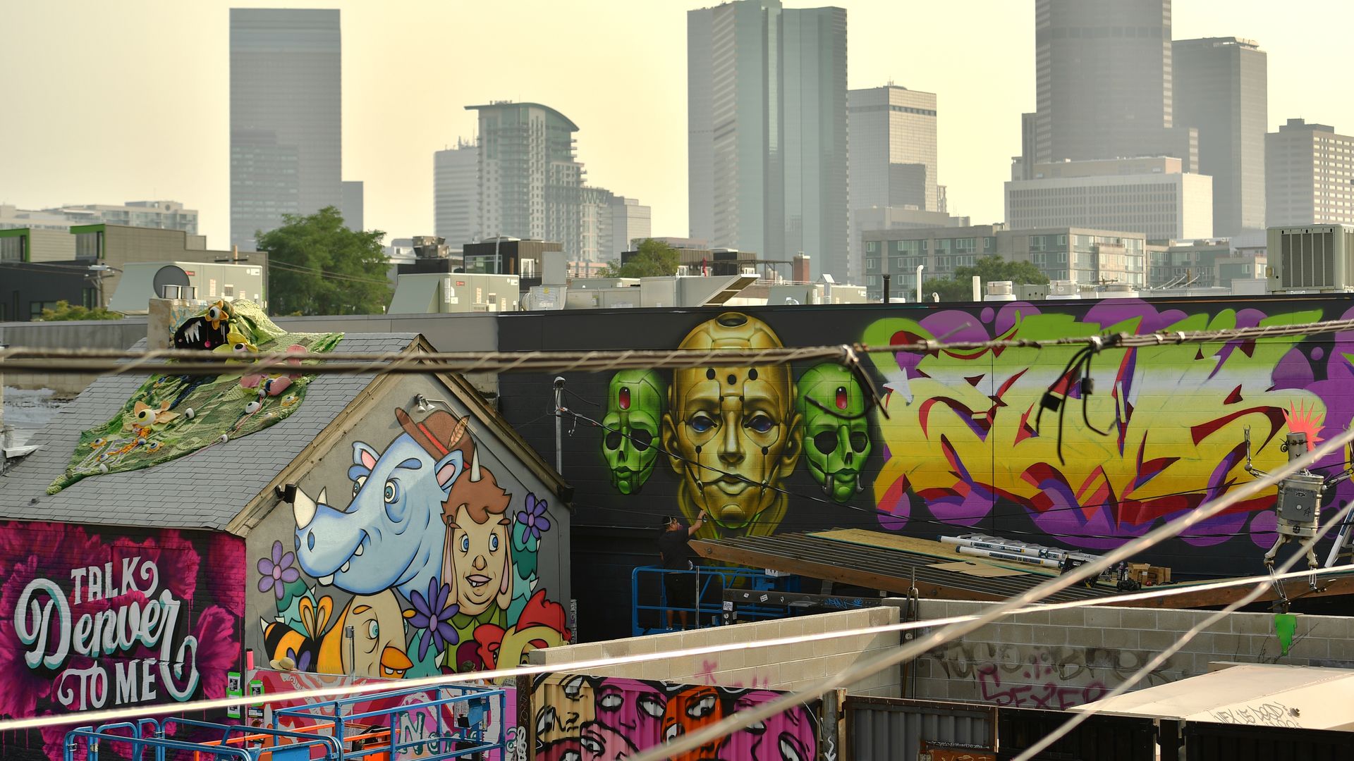 Murals in RiNo with downtown in the distance. Photo: Hyoung Chang/The Denver Post